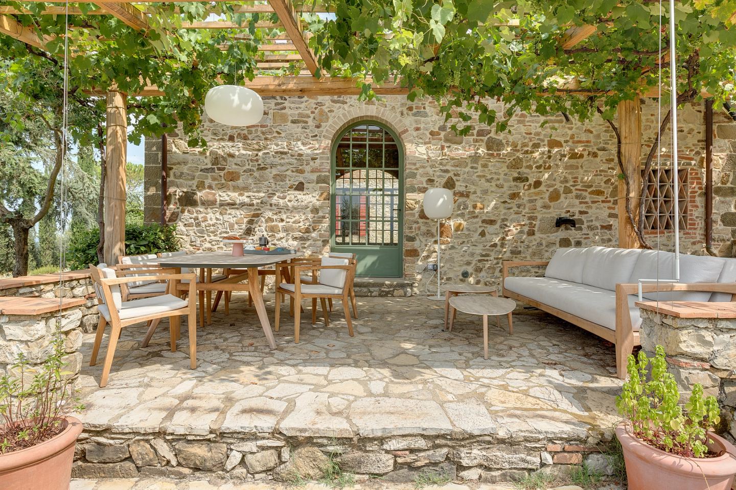 The terrace against the stone wall