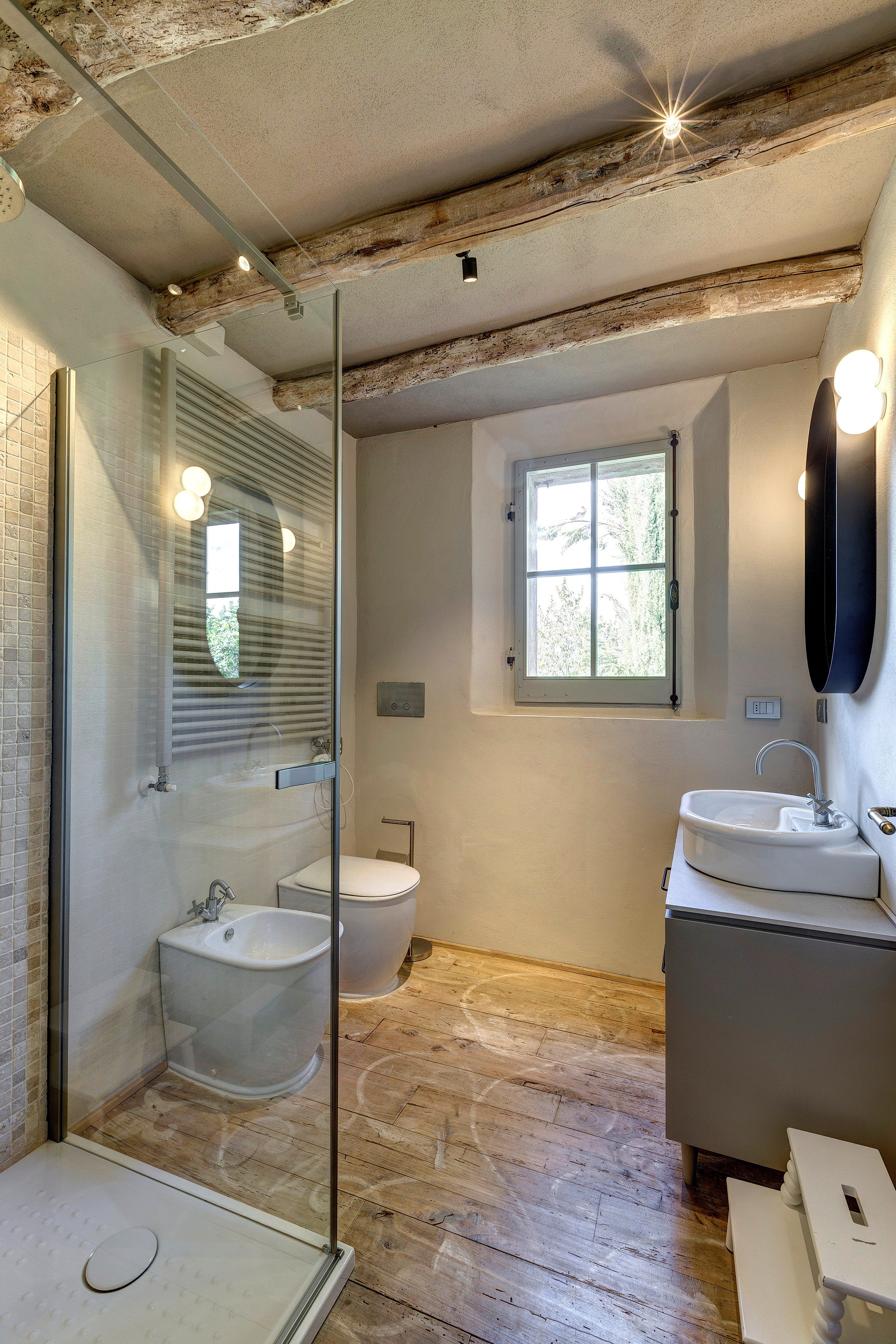 A bathroom in the sleeping area: shower, window and a made-to-measure cabinet
