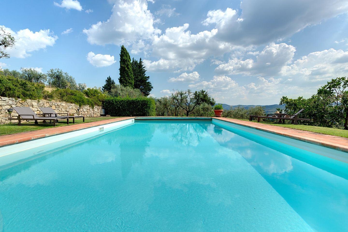 The pool empty under the clouds