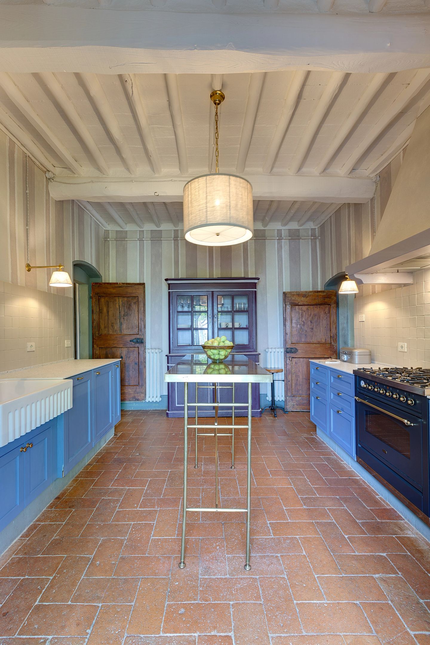 The kitchen along its length, the window at the end
