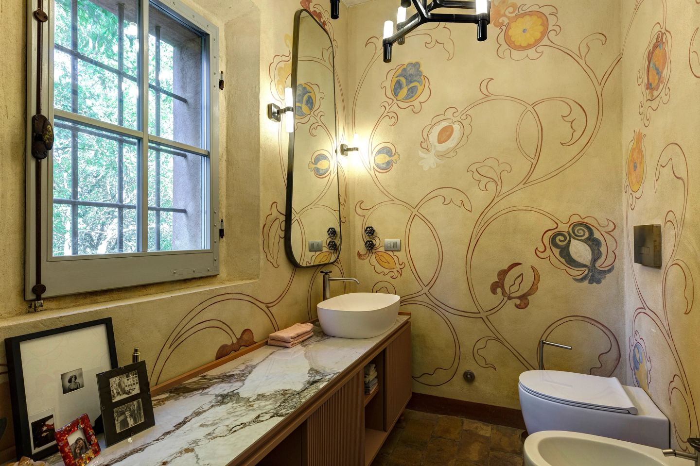 The guest bathroom: painted walls, a made-to-measure cabinet under a marble top