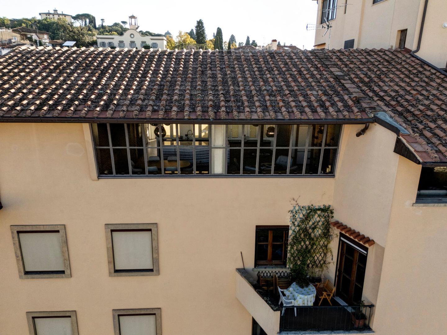 The building's roofline and the terrace within it