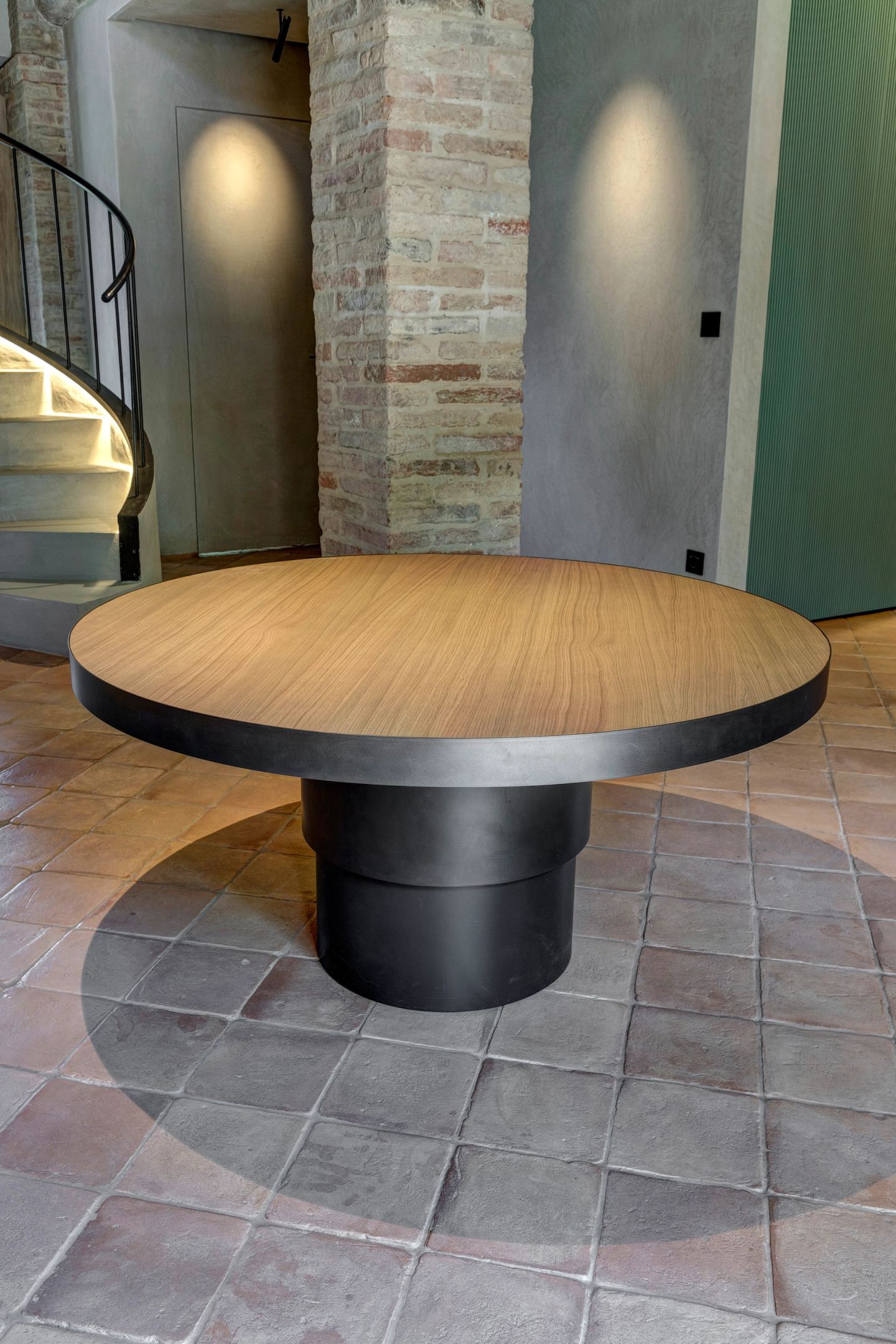 The round table with the stair behind it