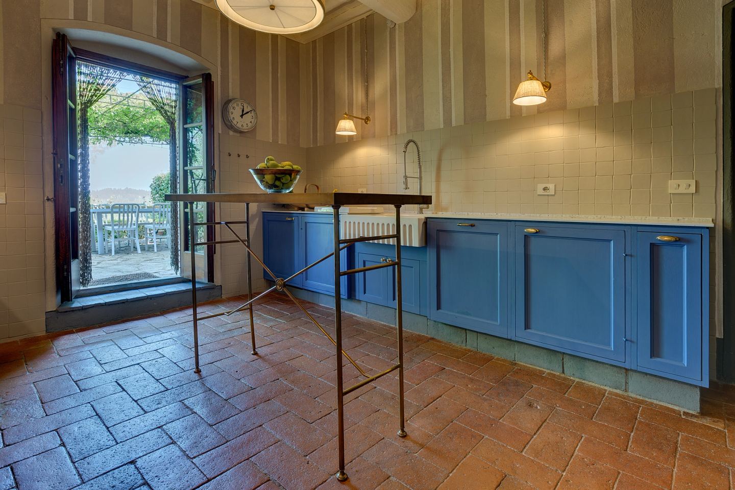 The brass island in front of the garden door