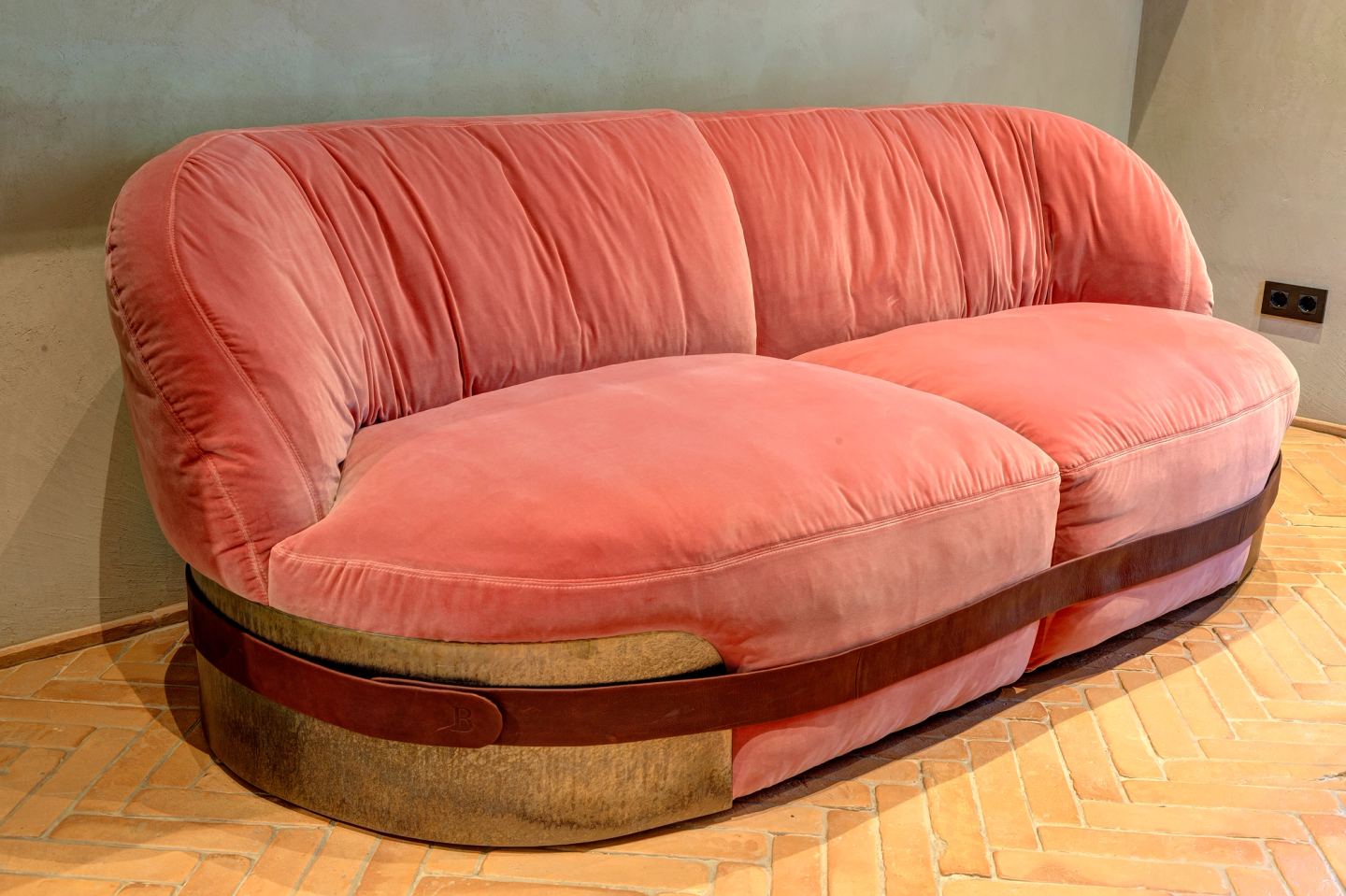 The sofa in full on the herringbone floor