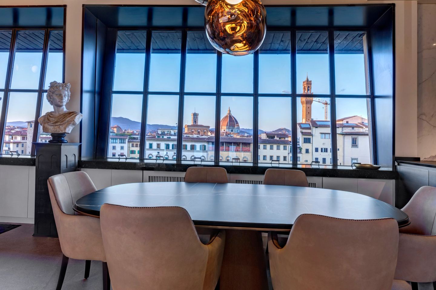 The table set against the full width of the window wall