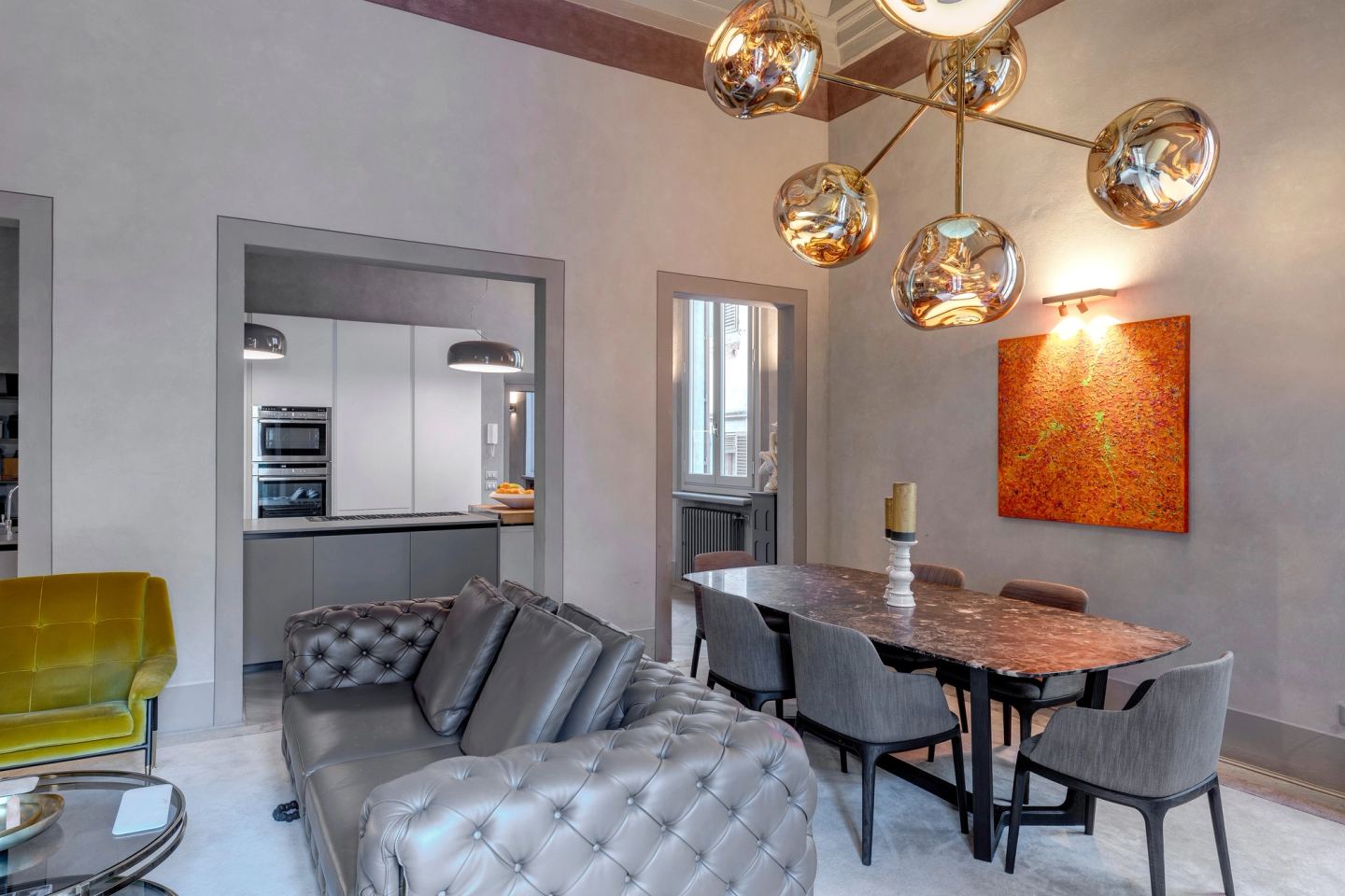 The dining table, and the kitchen through the doorway