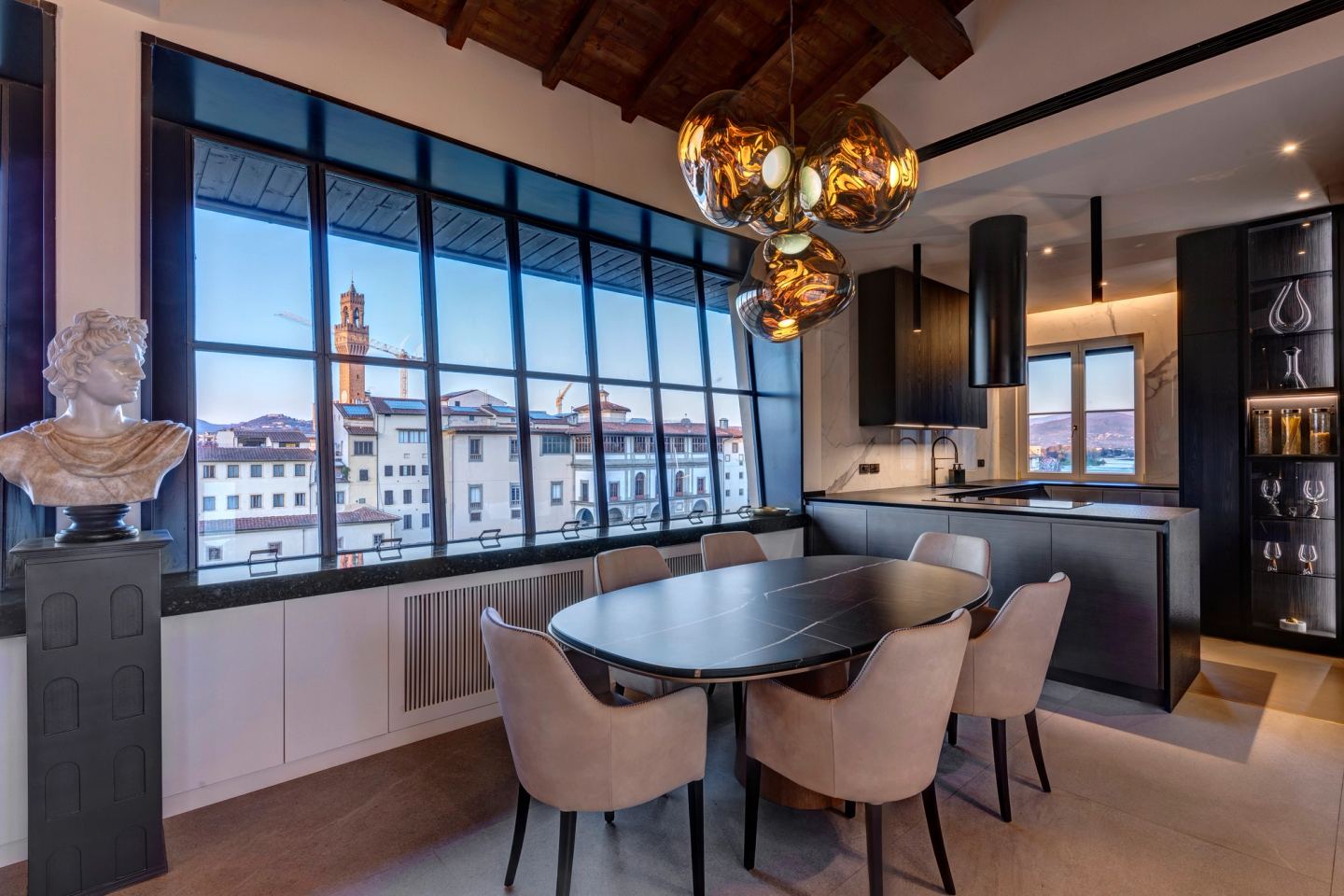 Round table and chairs, Palazzo Vecchio over the rooftops