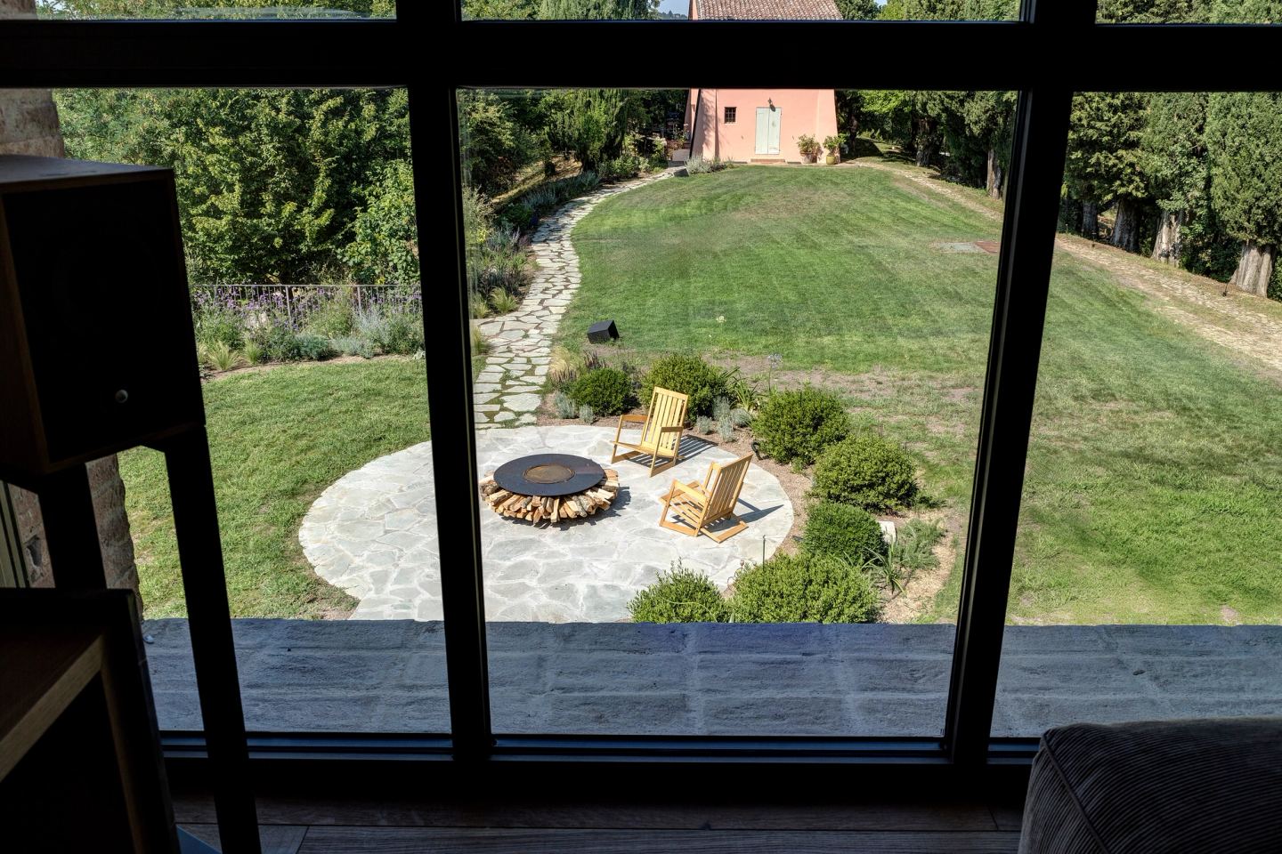 The fire circle on the lawn, seen from the window