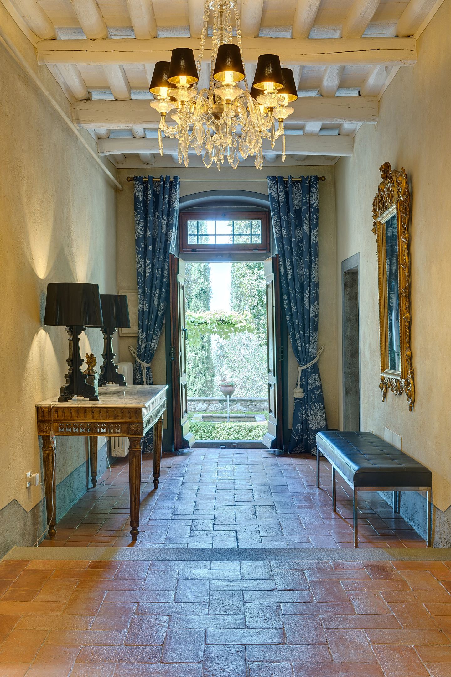 Console and blue bench along the hall