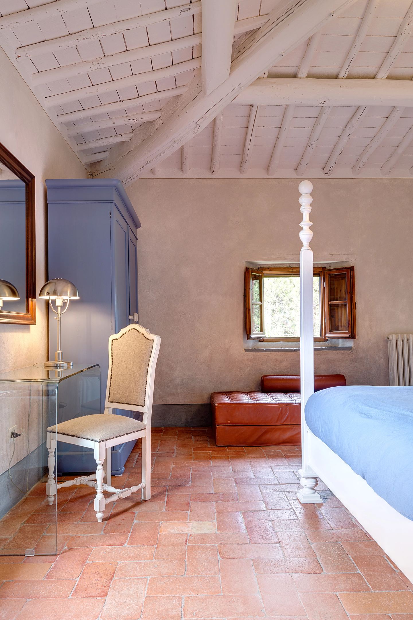 The blue cupboard beside the bed