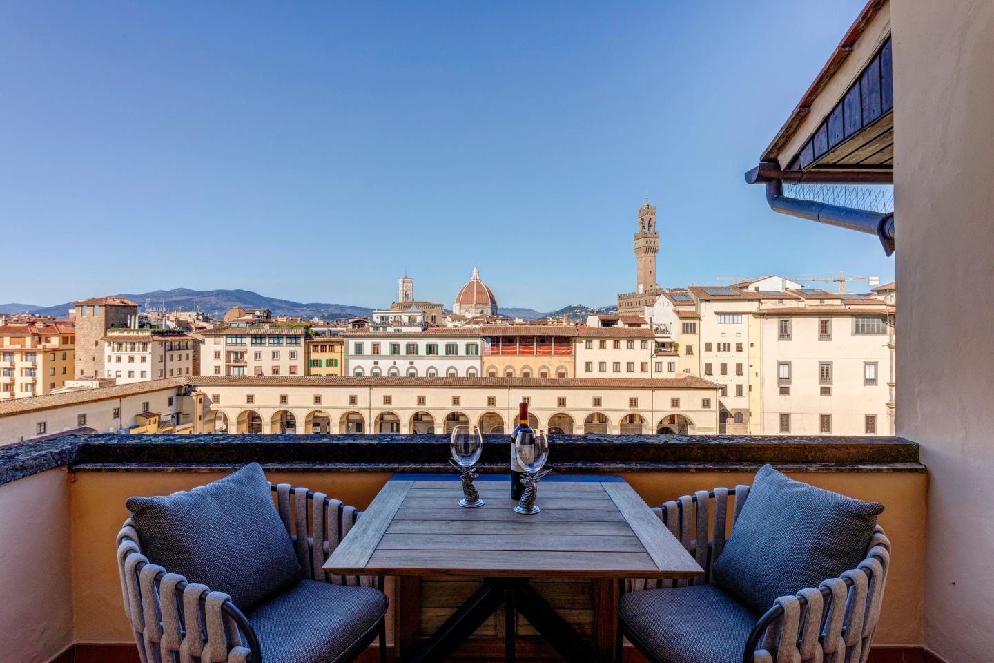 The terrace table set for two, Palazzo Vecchio and the Duomo beyond