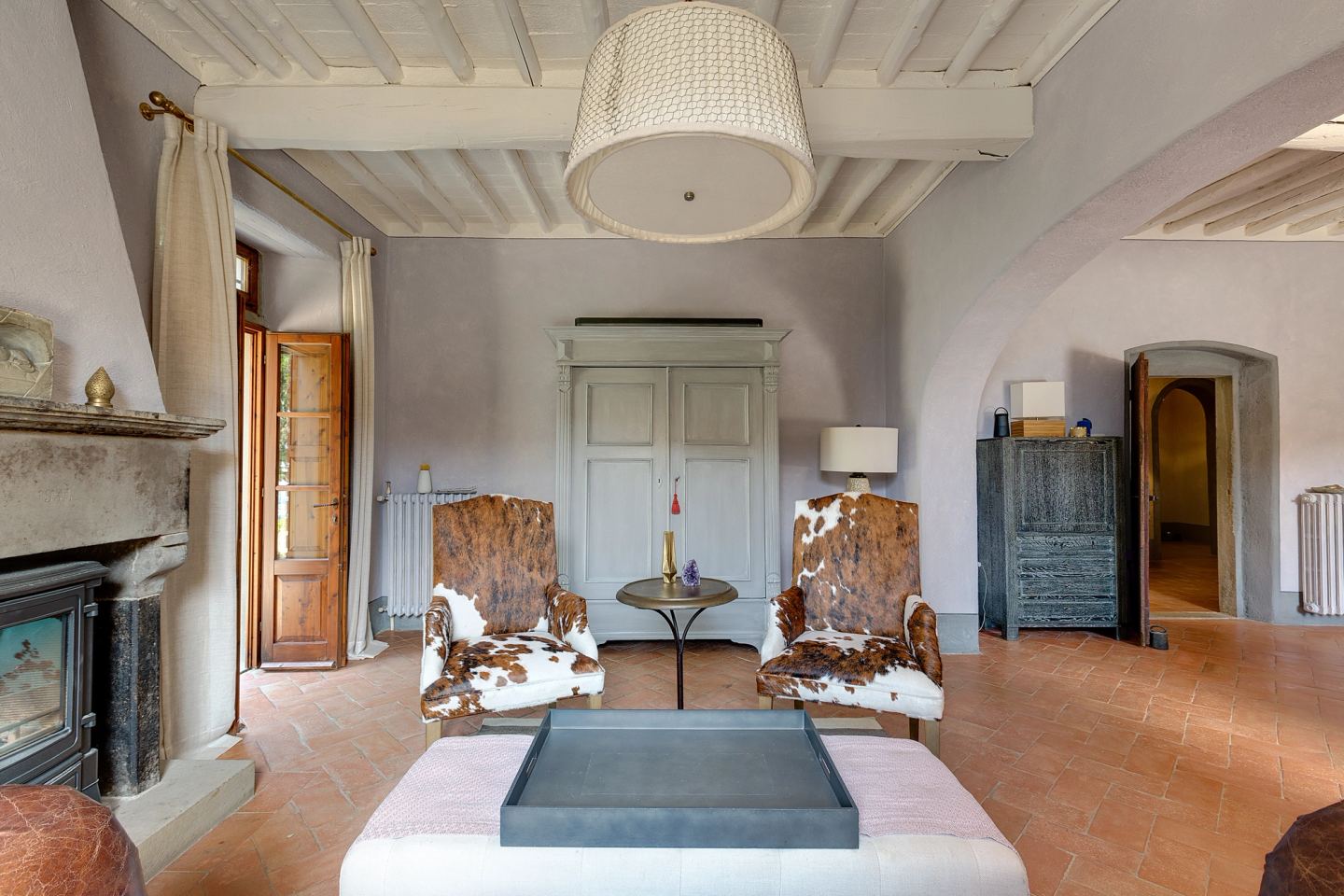 The hearth with its armchairs, hide on the floor