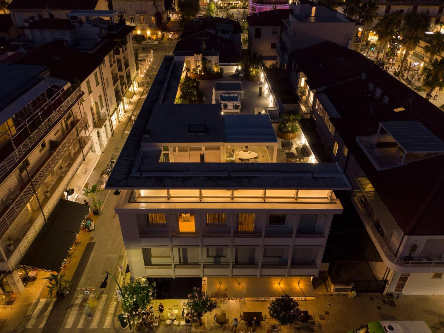 The building lit among its neighbours