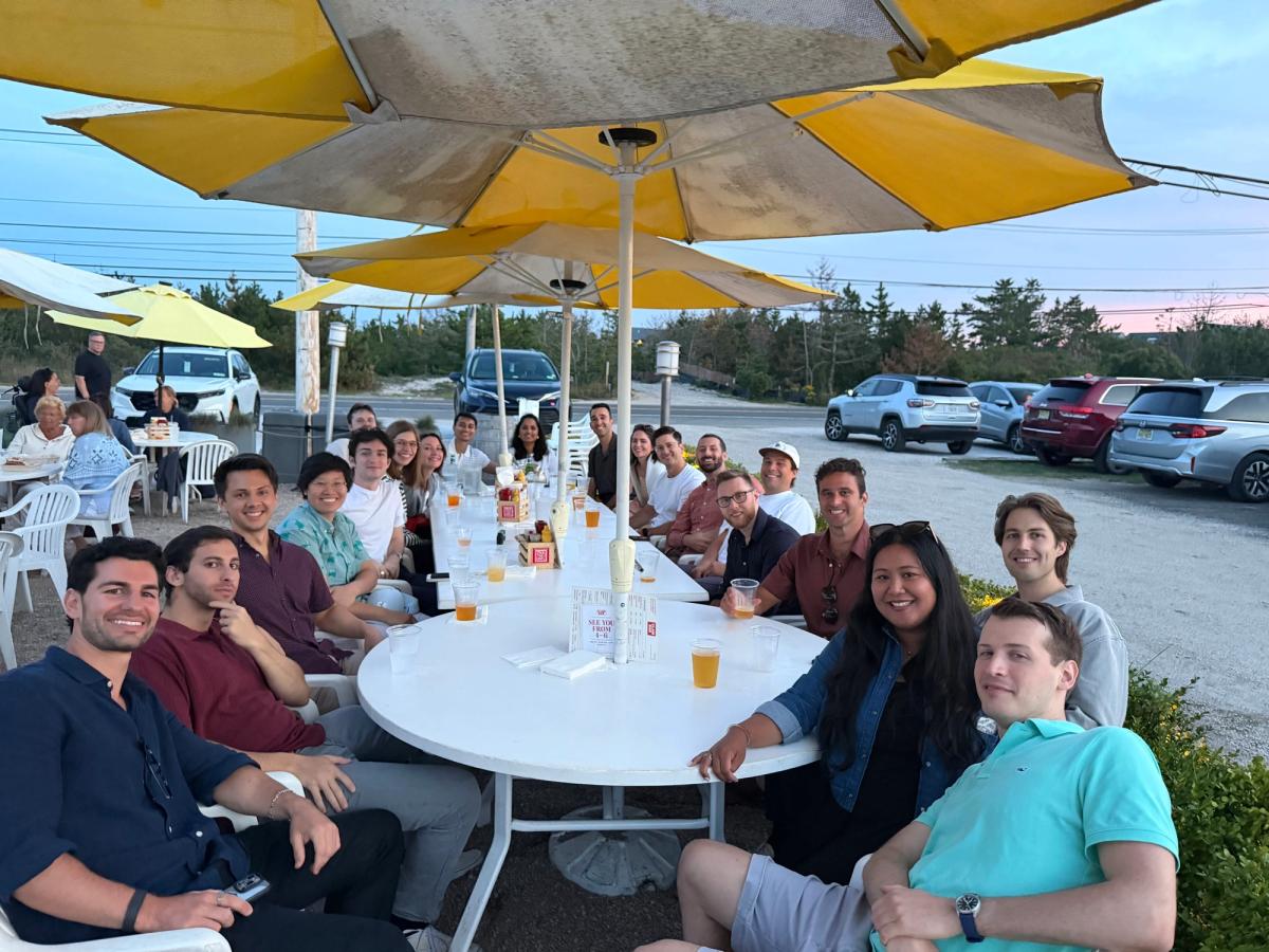 Qualitate team sharing an outdoor meal