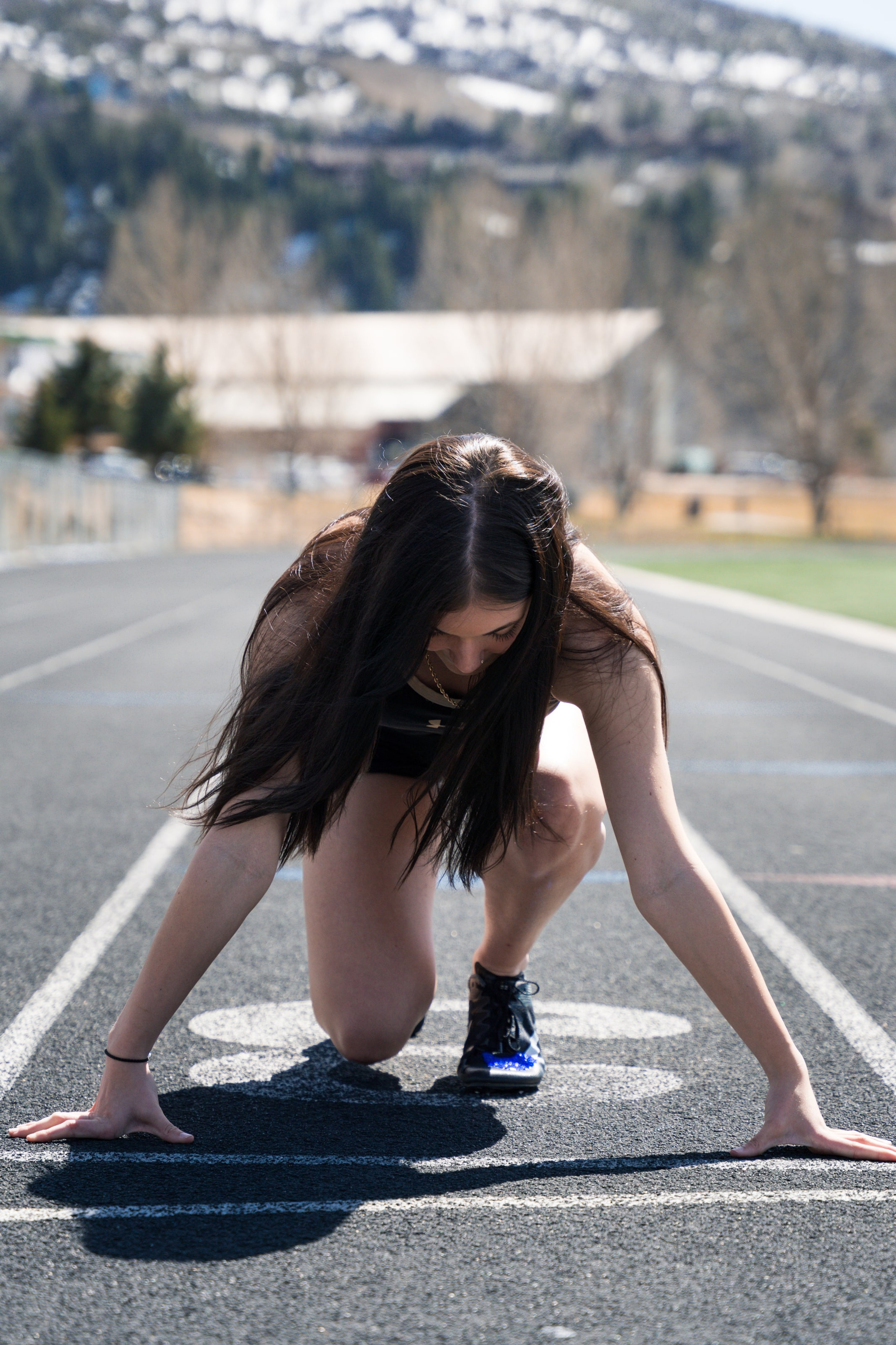 Lucy head-down in the blocks a breath before the start