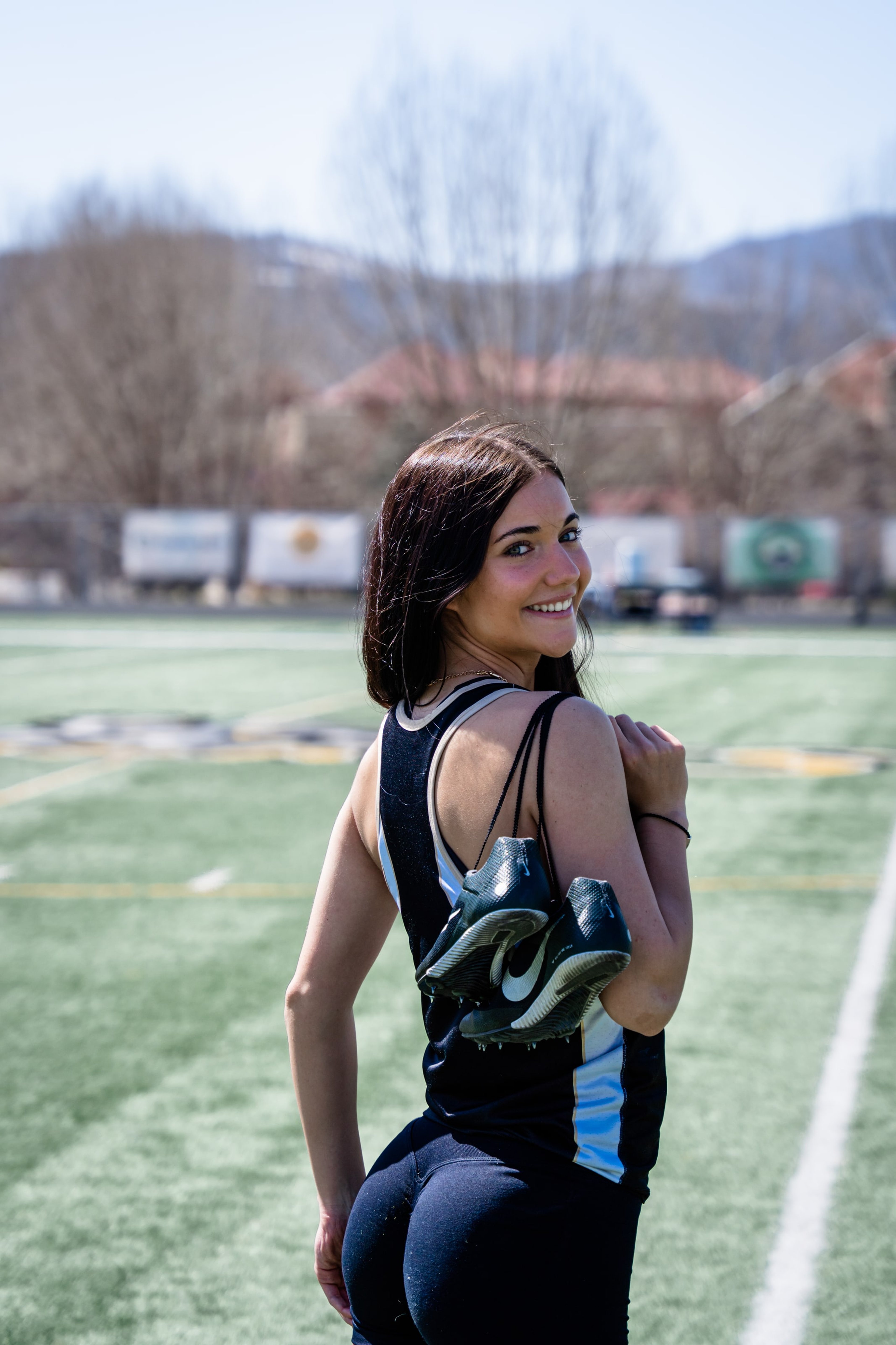 Lucy smiling over her shoulder on the back straight