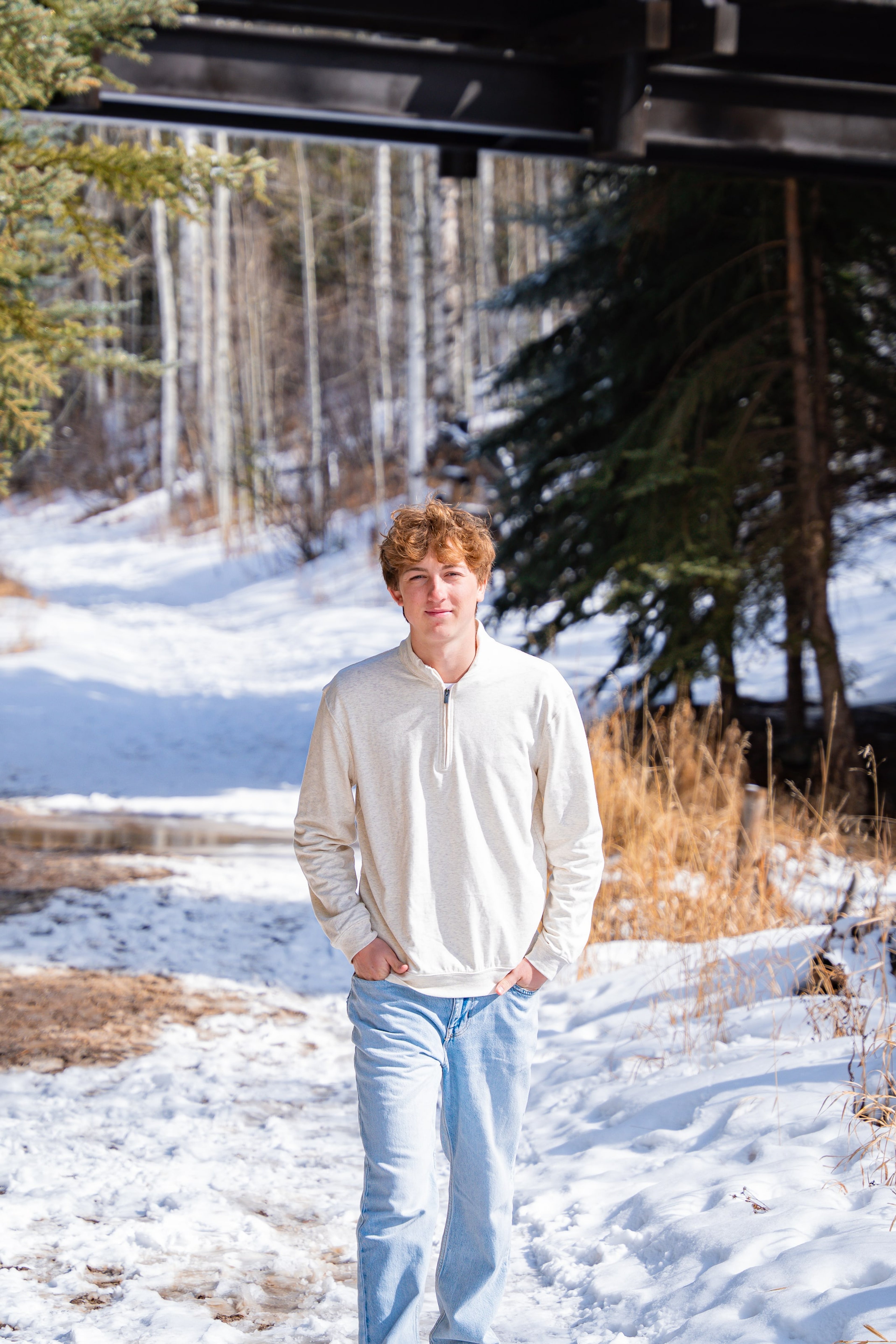 Wake standing hands-in-pockets by the frozen creek