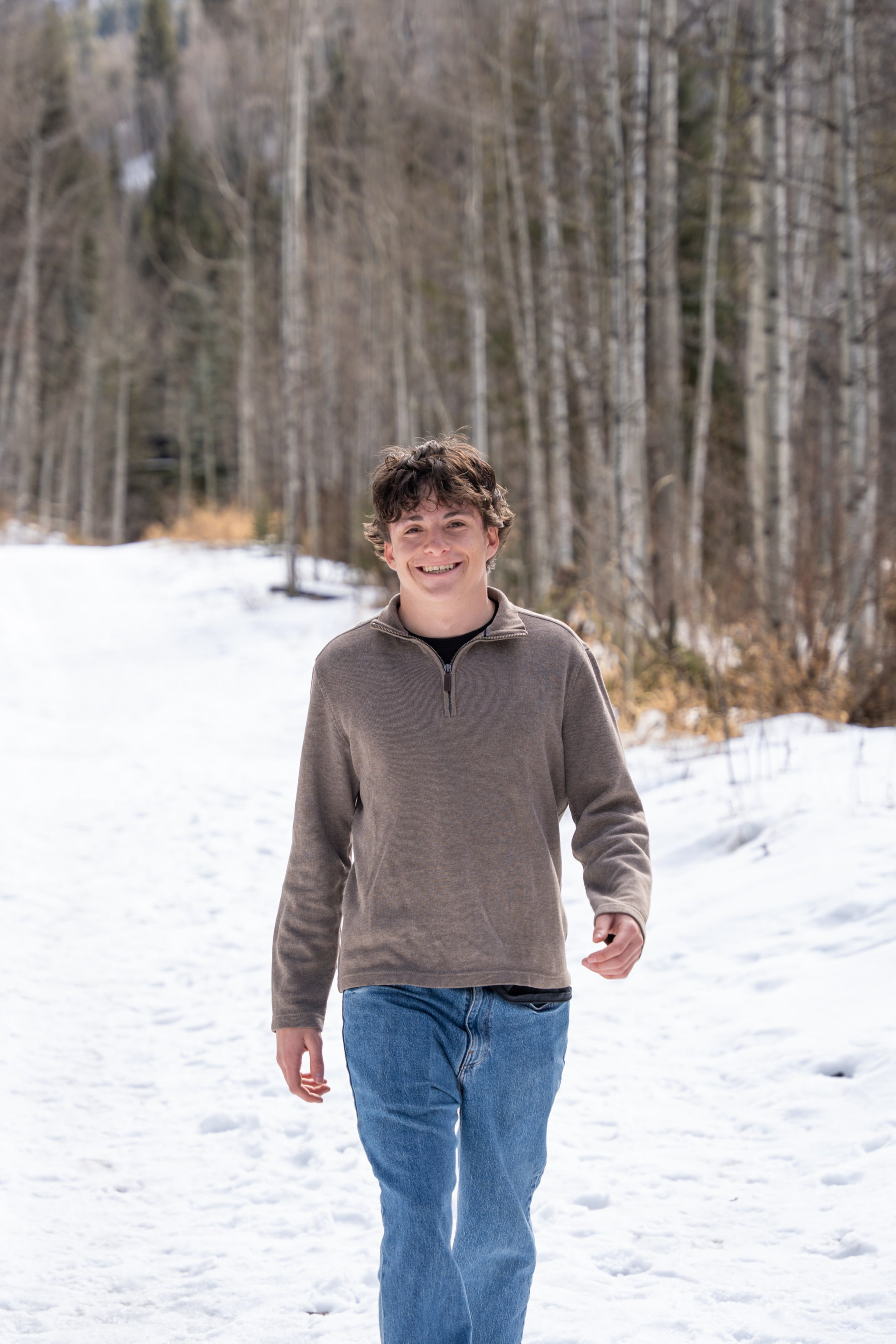 Luca walking toward the camera across the snowfield