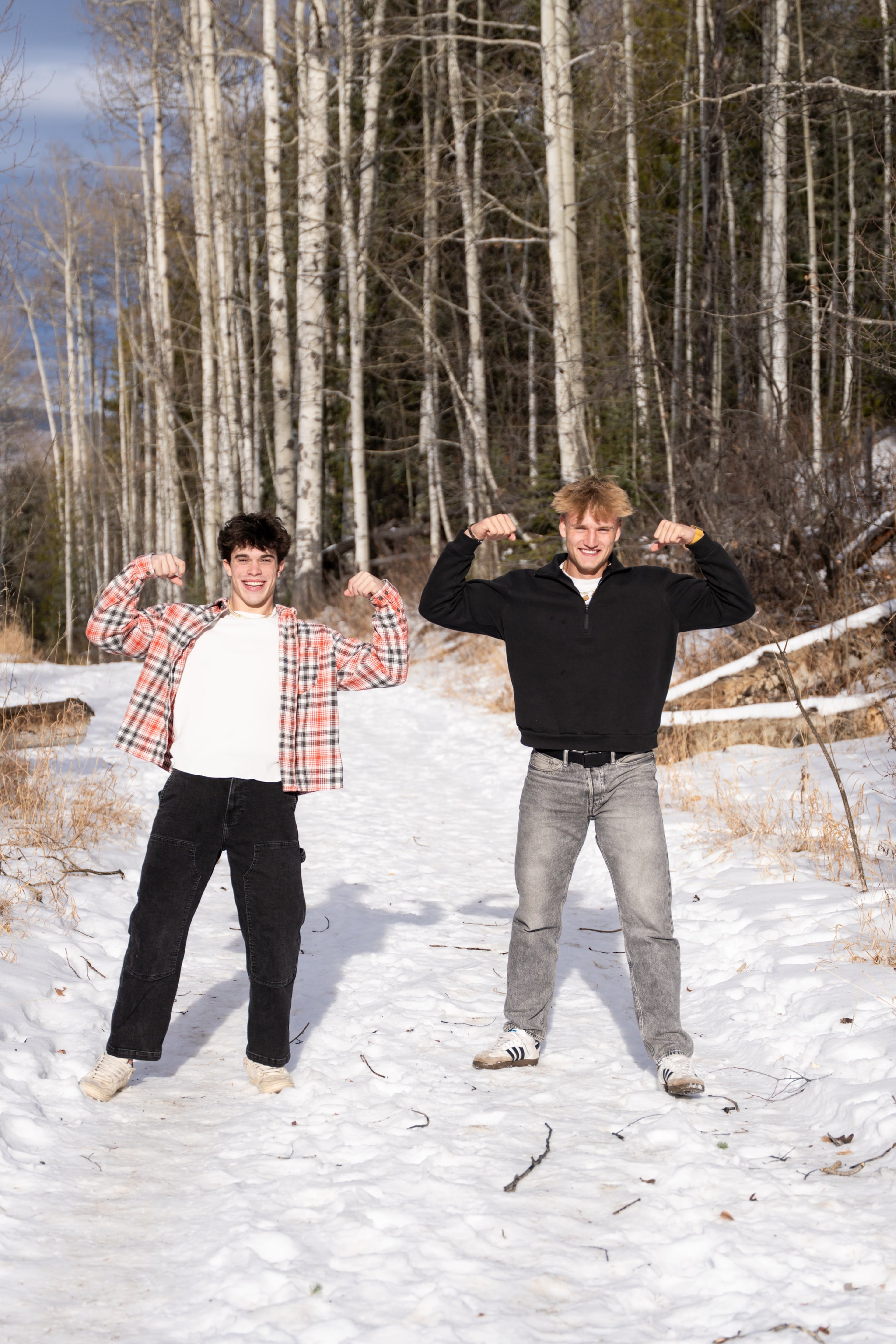 Jakob and Ryder striking poses on the snowy path