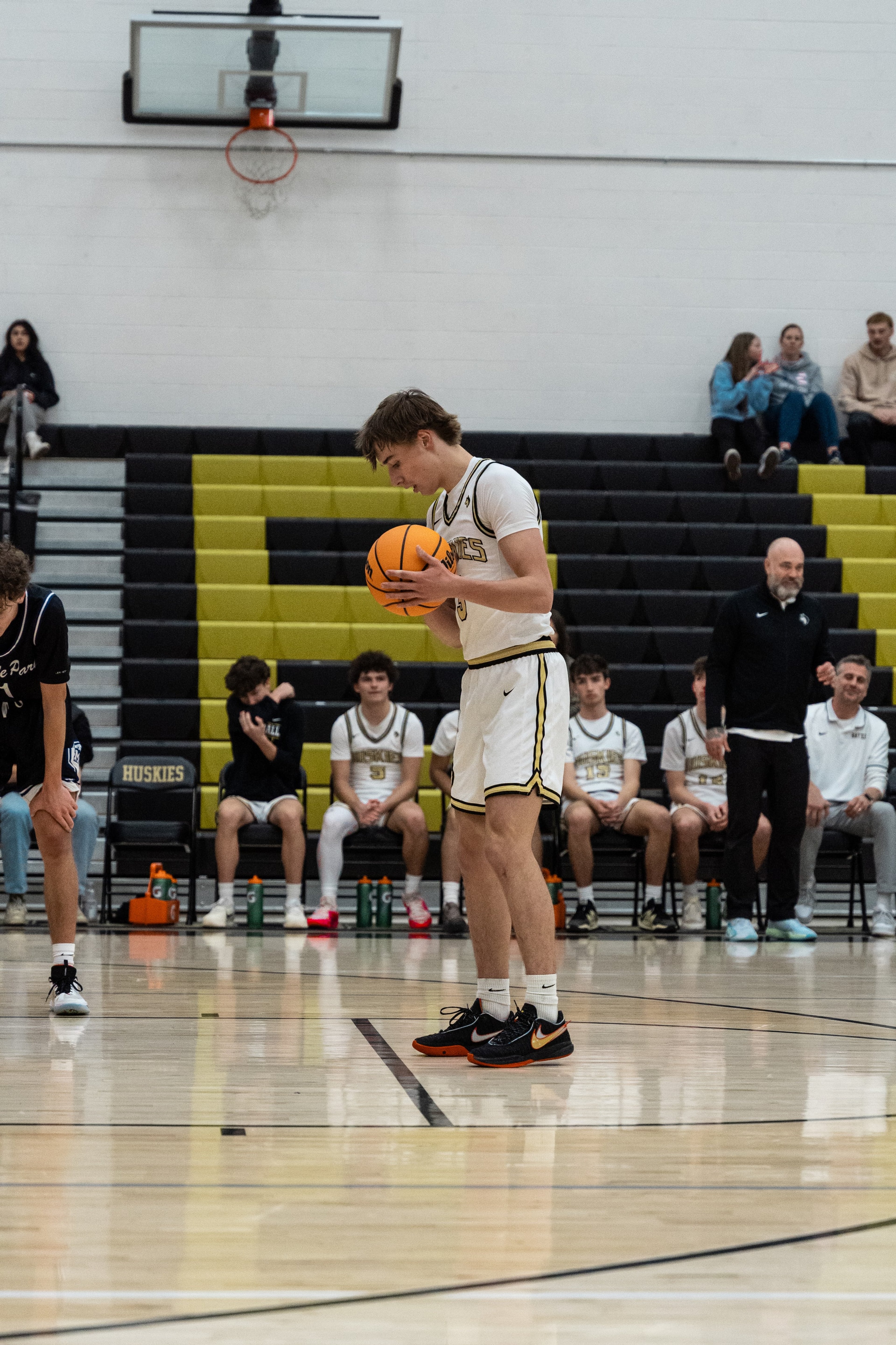 A player studies the ball before a free throw