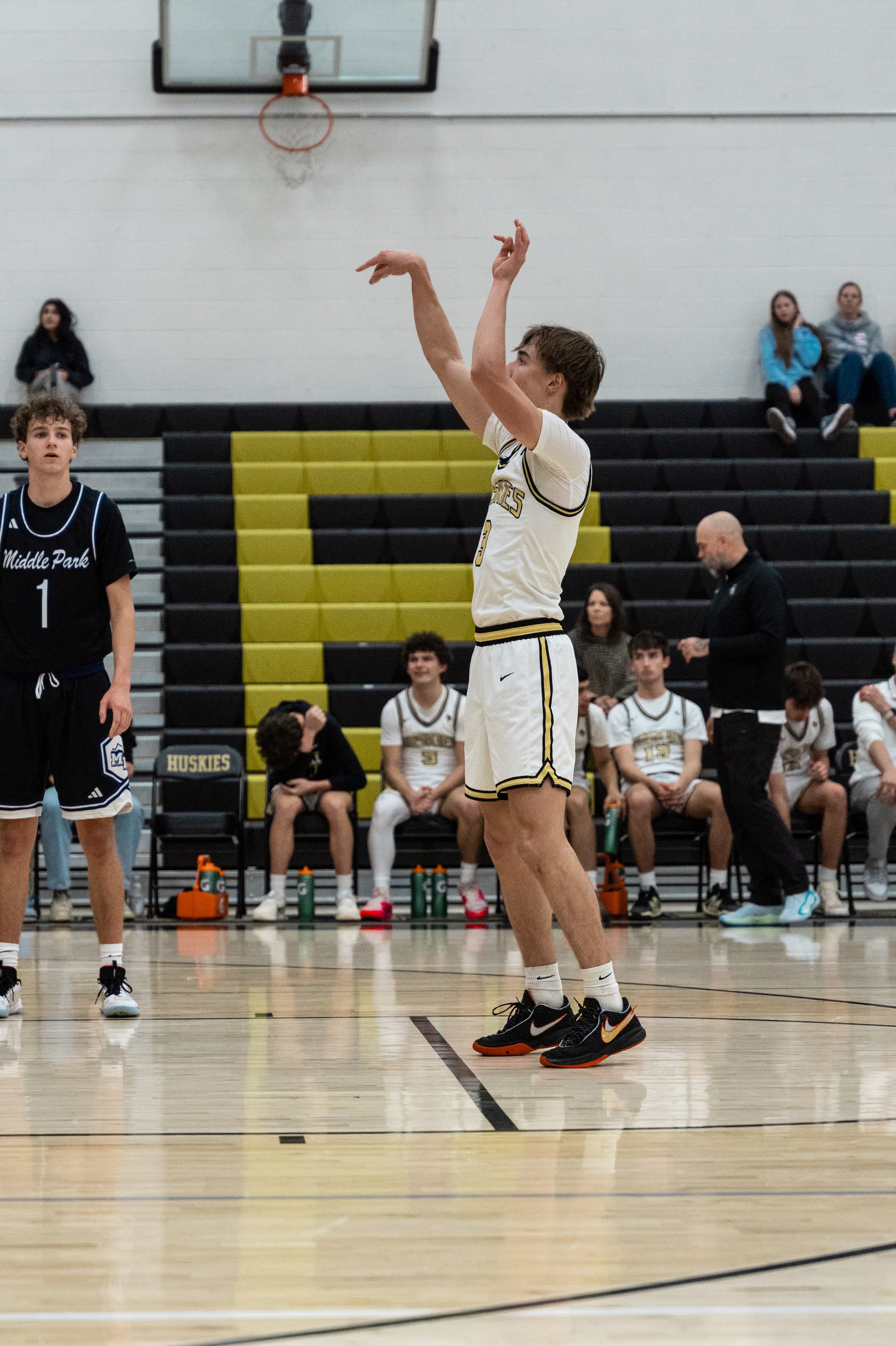 A player holds his follow-through after a free throw