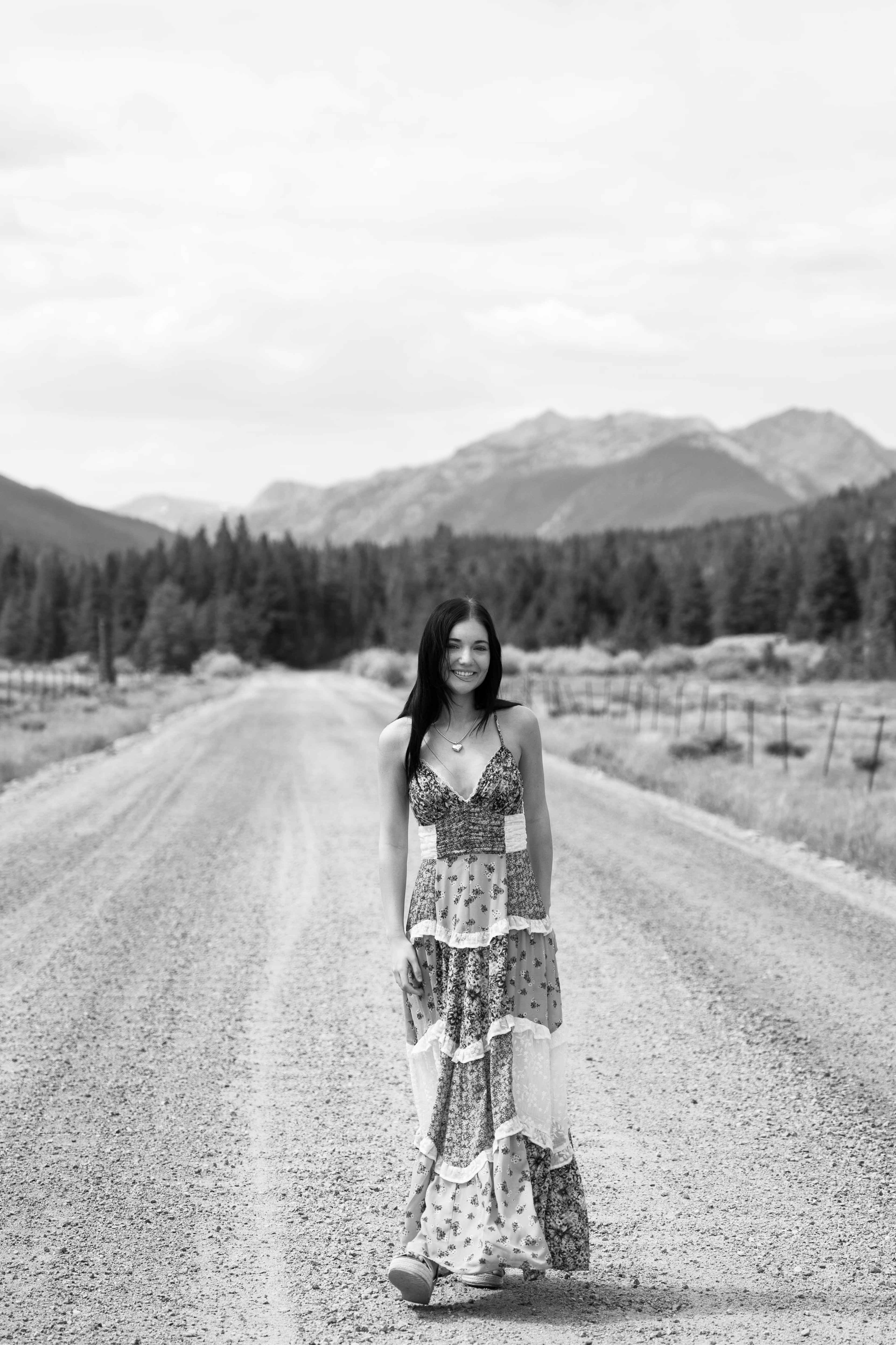 Lucy on an empty mountain road, in black and white