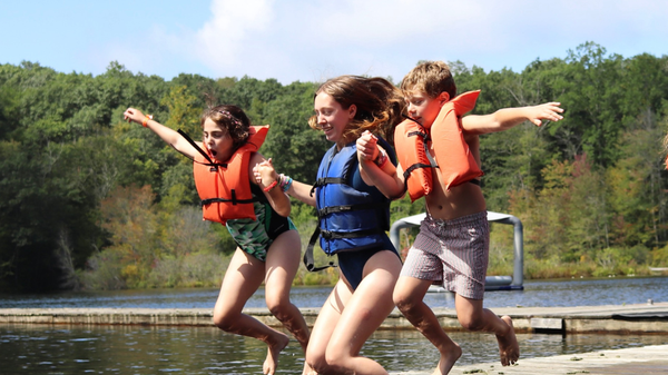What If My Child Has Trouble Making Friends at Camp? CL campers jumping into the lake.