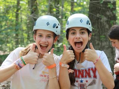 Campers at Laurelwood smiling at the ropes course!