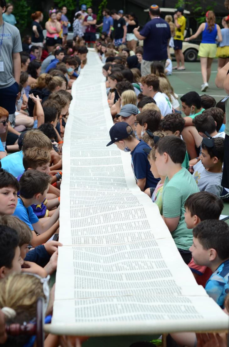 Torah scroll unrolled for campers