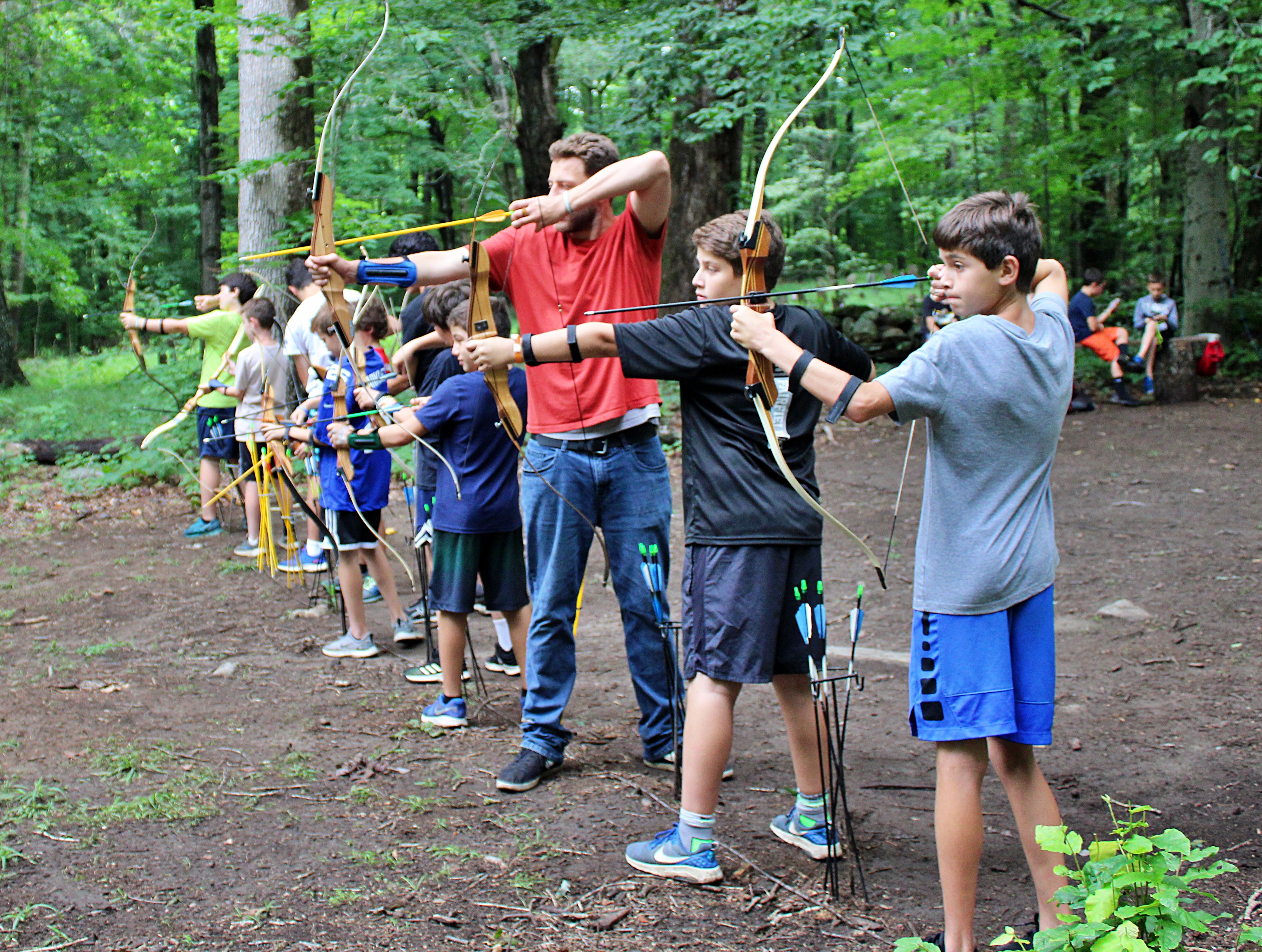two campers hodling archery bows at Camp Laurelwood