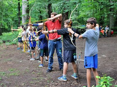 two campers hodling archery bows at Camp Laurelwood