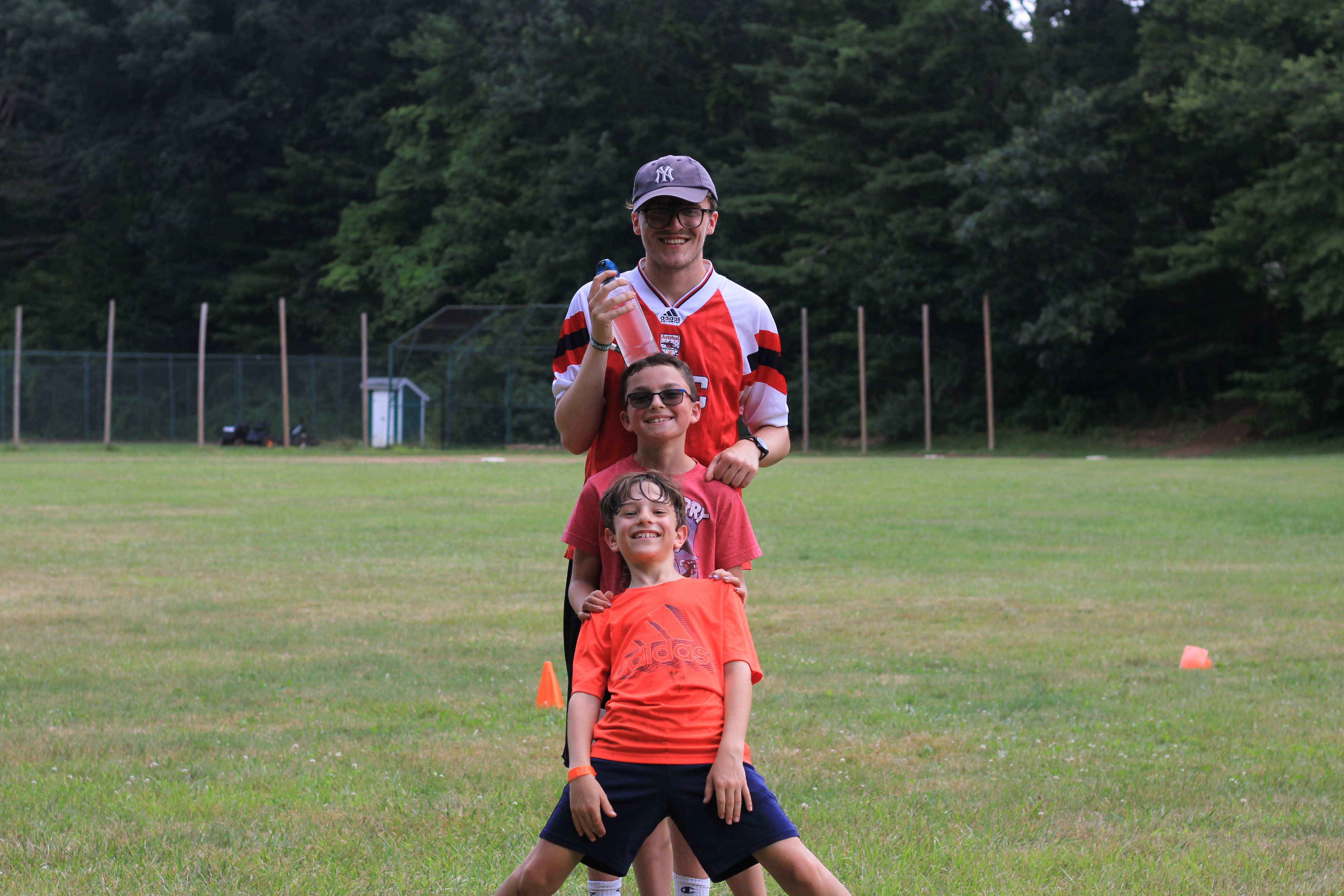 male counselor and campers