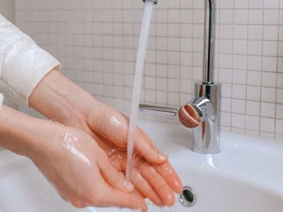 person washing hands
