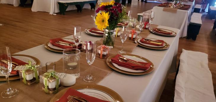event talbe set with dishes, cutlery and flowers, waiting for event guests, at the Laurelwood Retreat Center