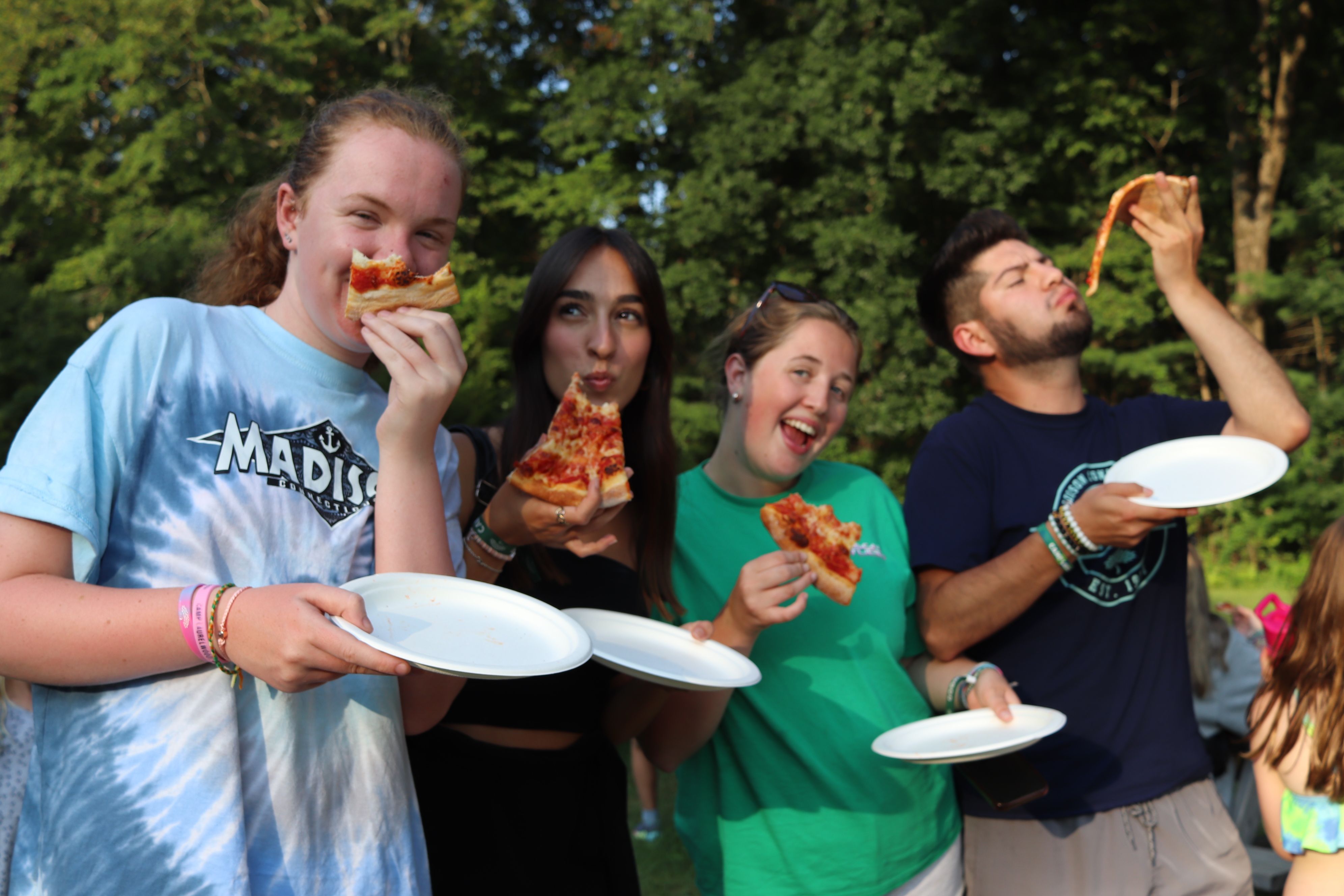staff enjoying pizza