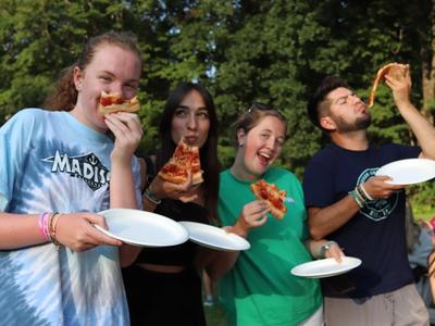 staff enjoying pizza