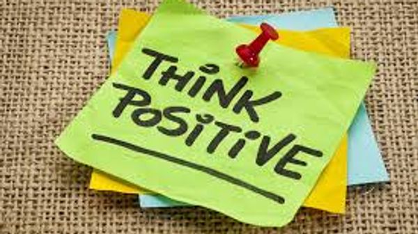 post it notes that say "Think Positive!" on them