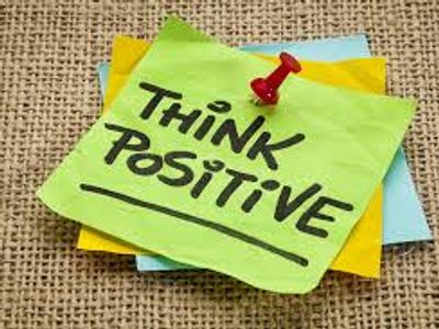 post it notes that say "Think Positive!" on them