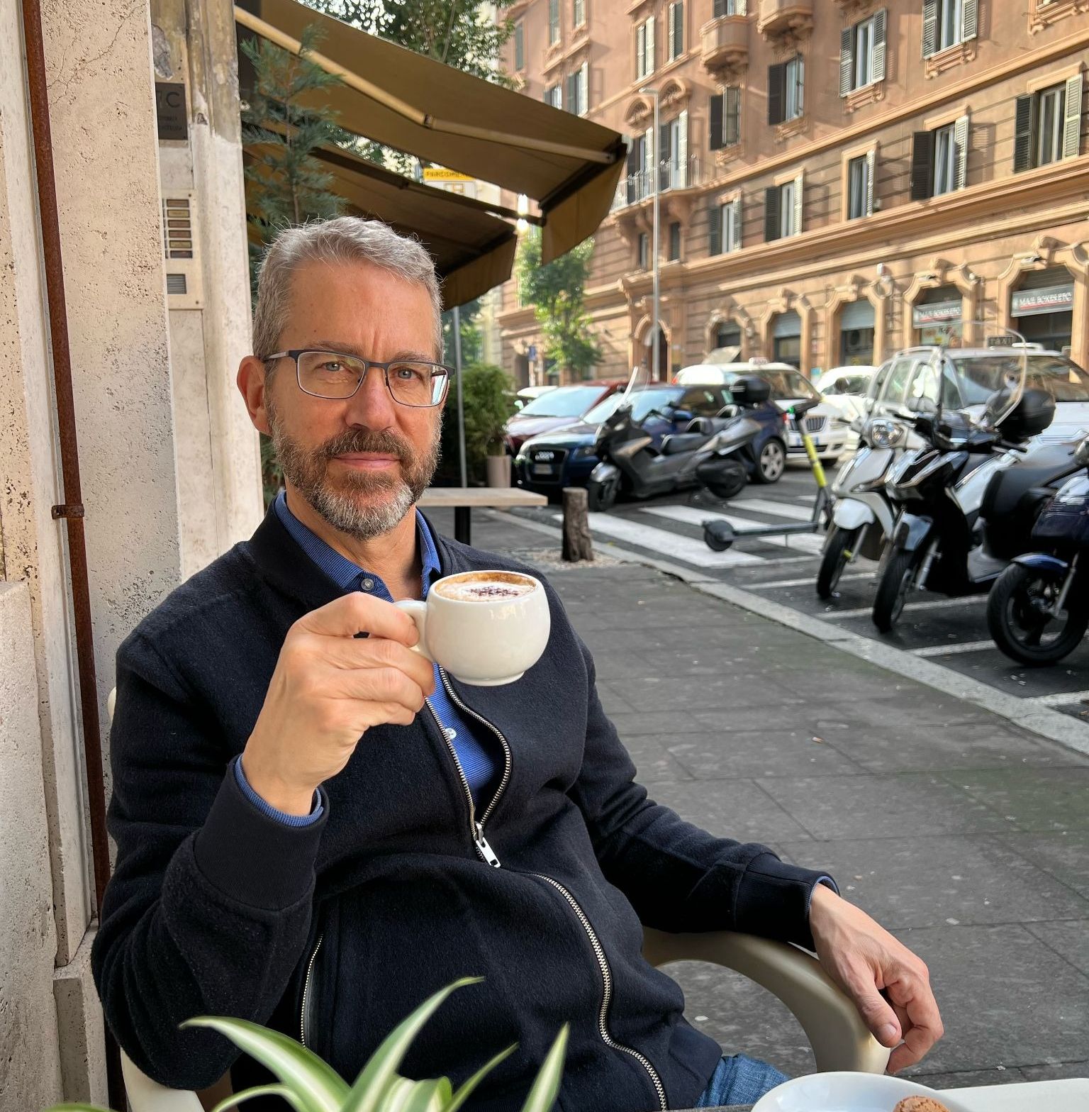 headshot of Speaker 1