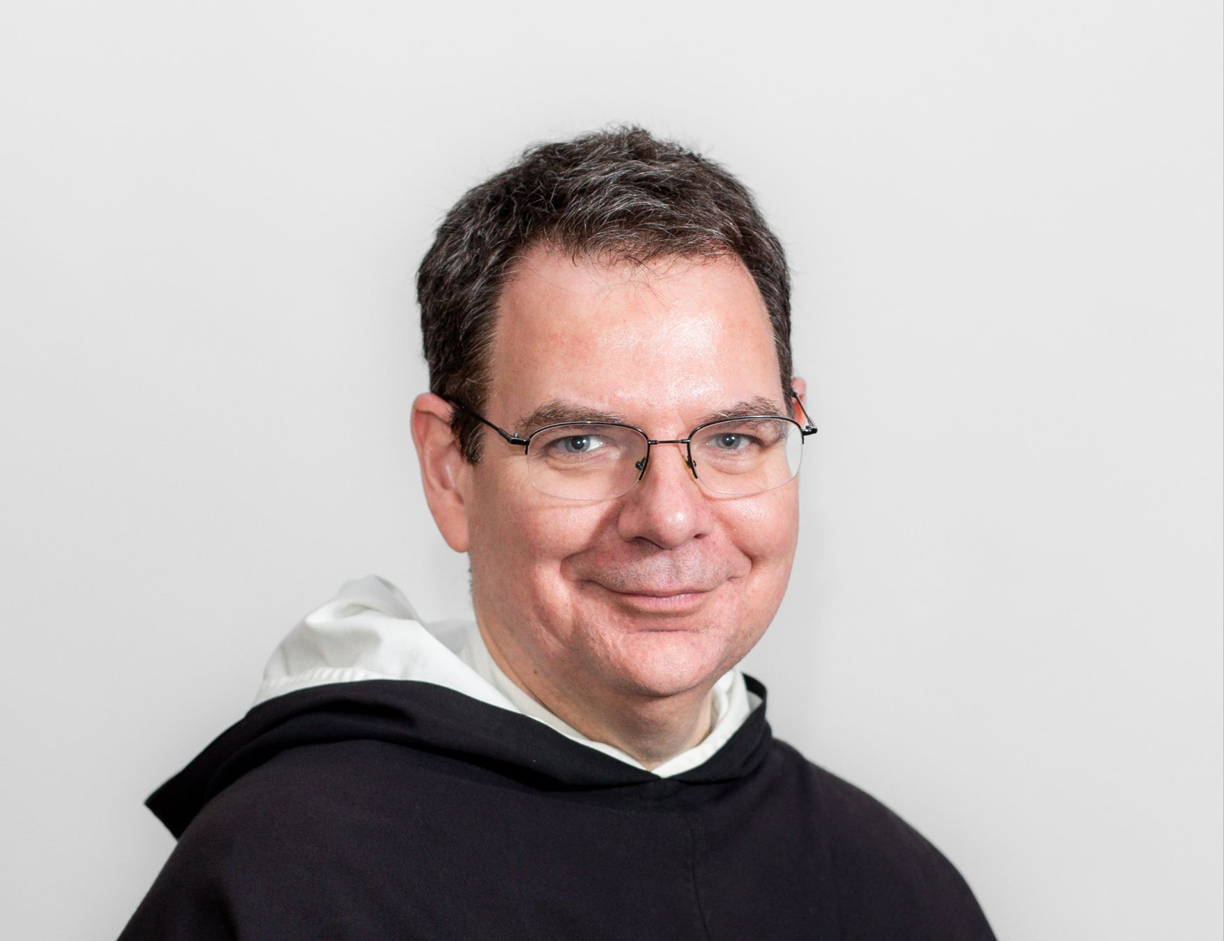 headshot of Speaker 1