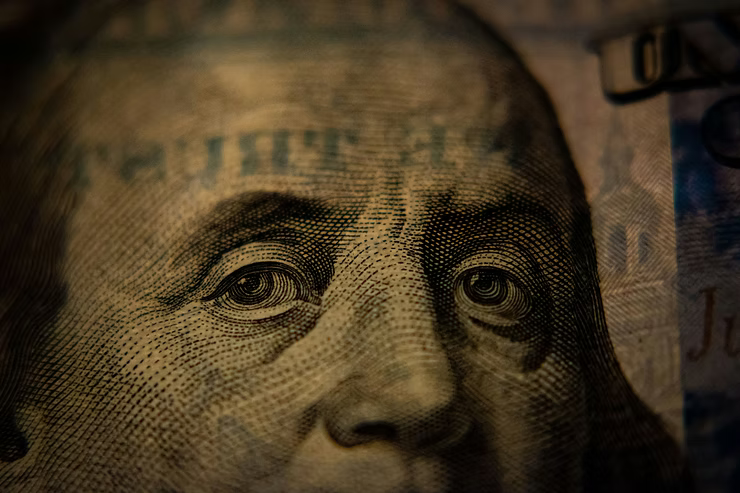 Close up of a $100 bill, focused on Benjamin Franklin's face