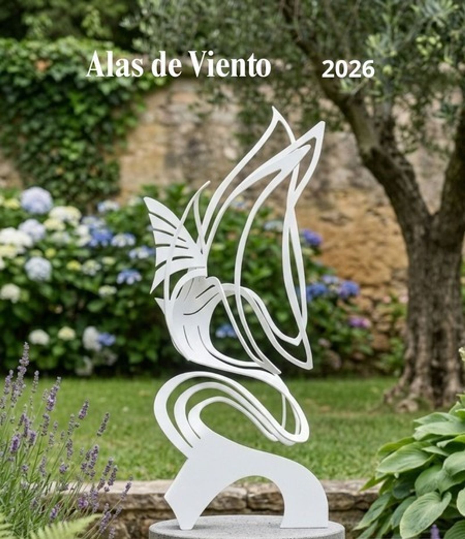 Alas de Viento, a black painted iron winged sculpture on a concrete pedestal in a Mediterranean courtyard garden