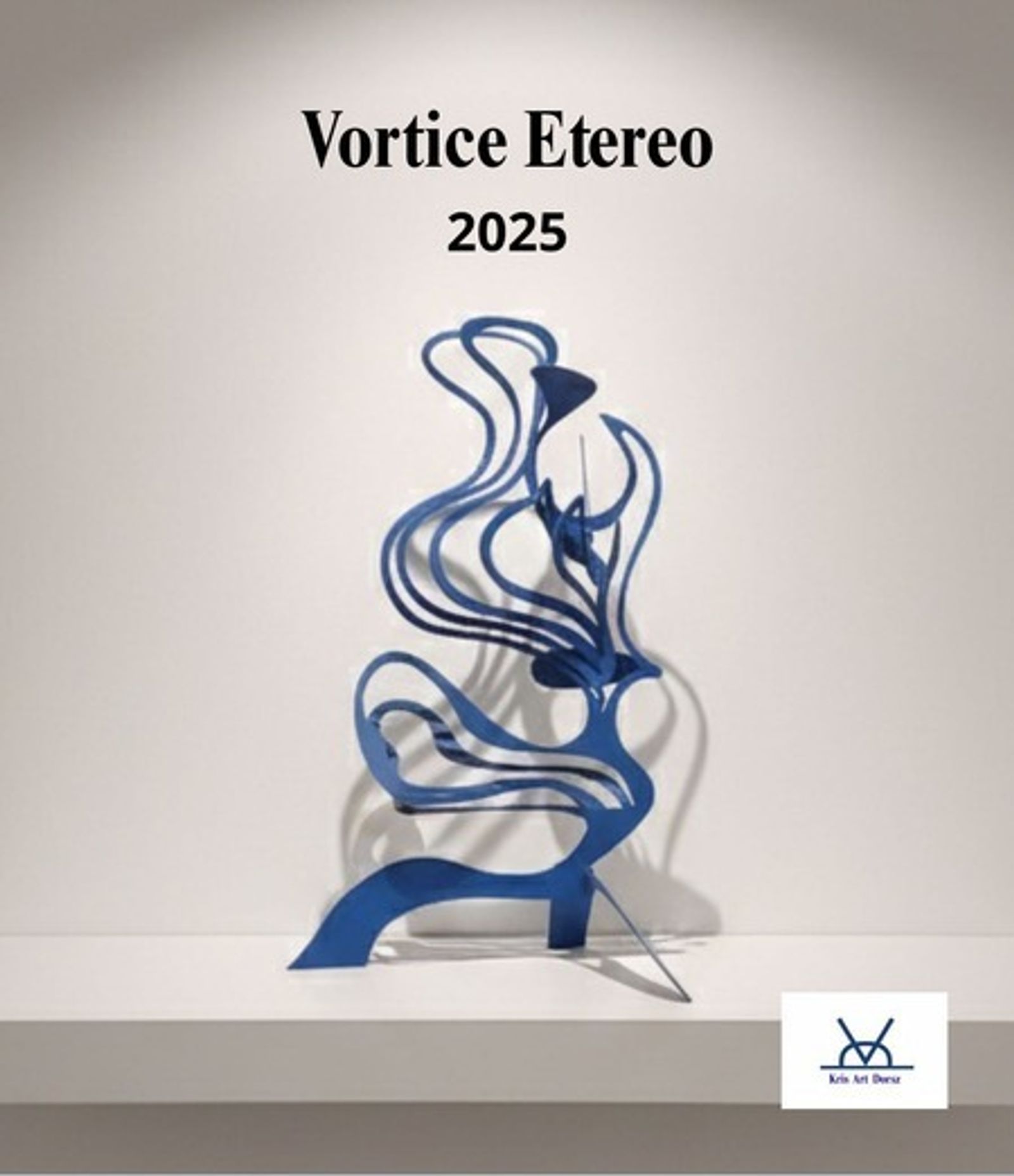 Vortice Etereo, a blue painted iron spiraling sculpture displayed against a plain studio wall