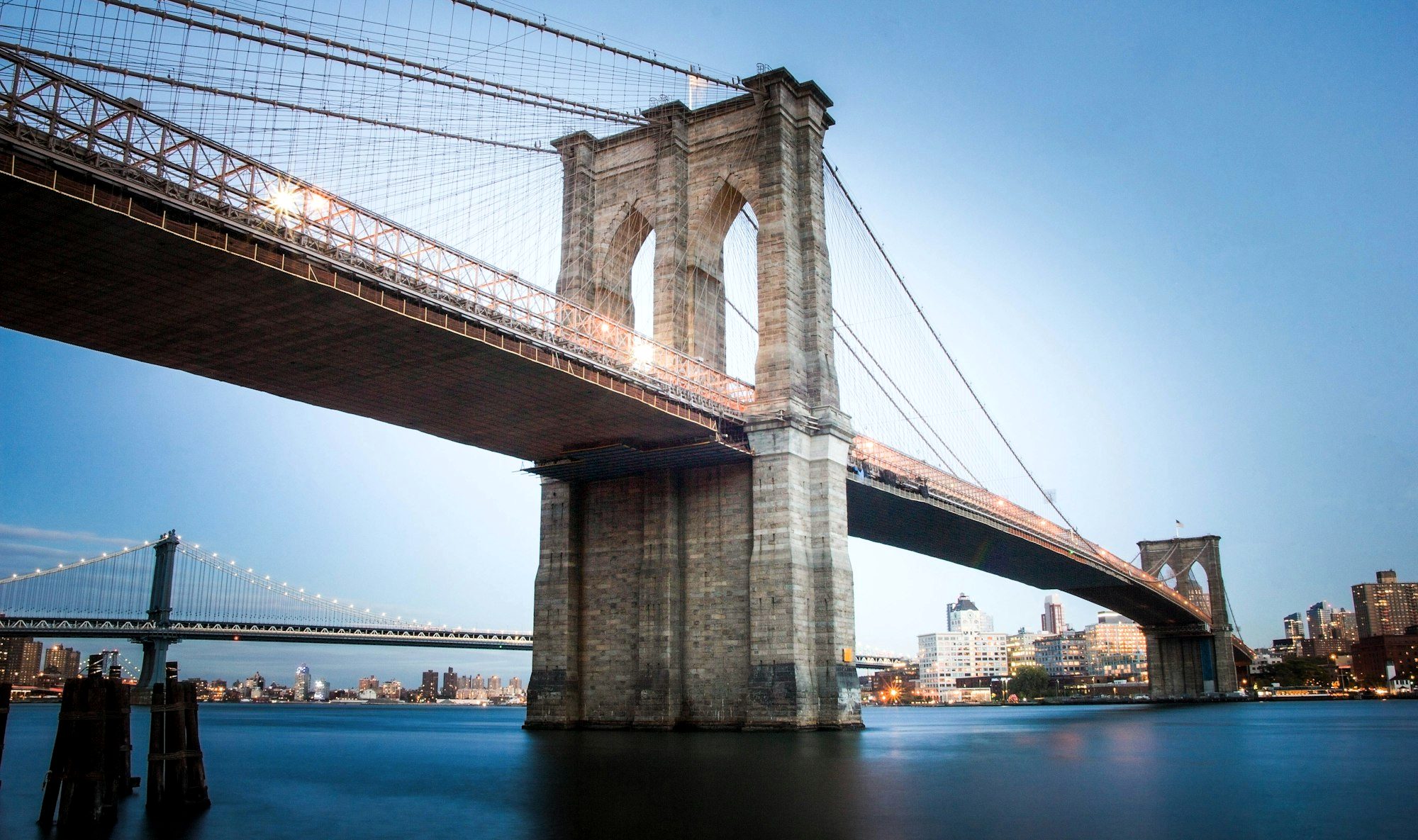 The Brooklyn Bridge and the Manhattan skyline at dusk