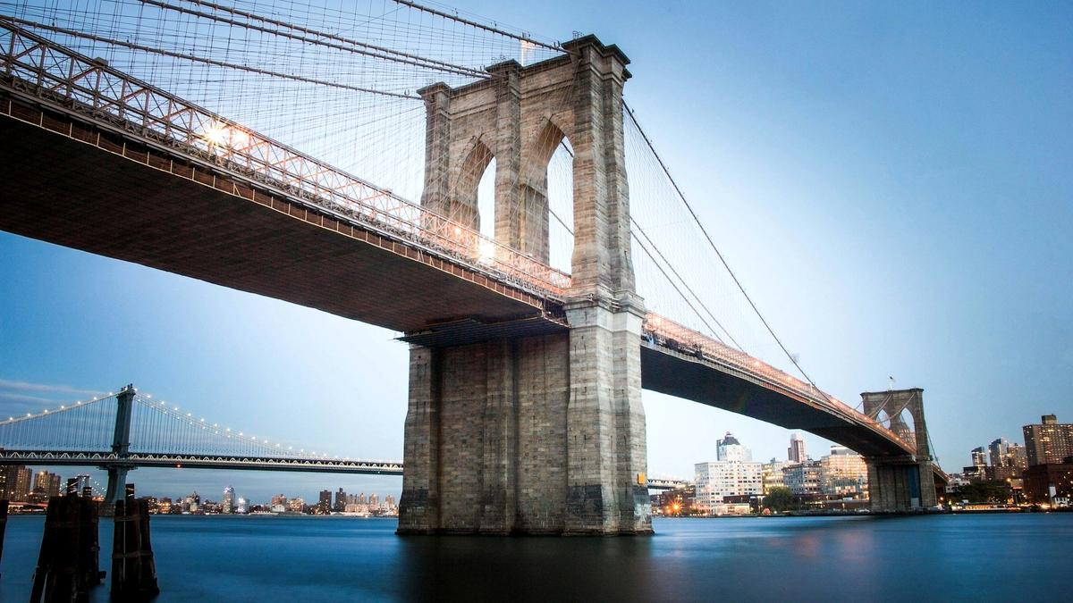 The Brooklyn Bridge and the Manhattan skyline at dusk