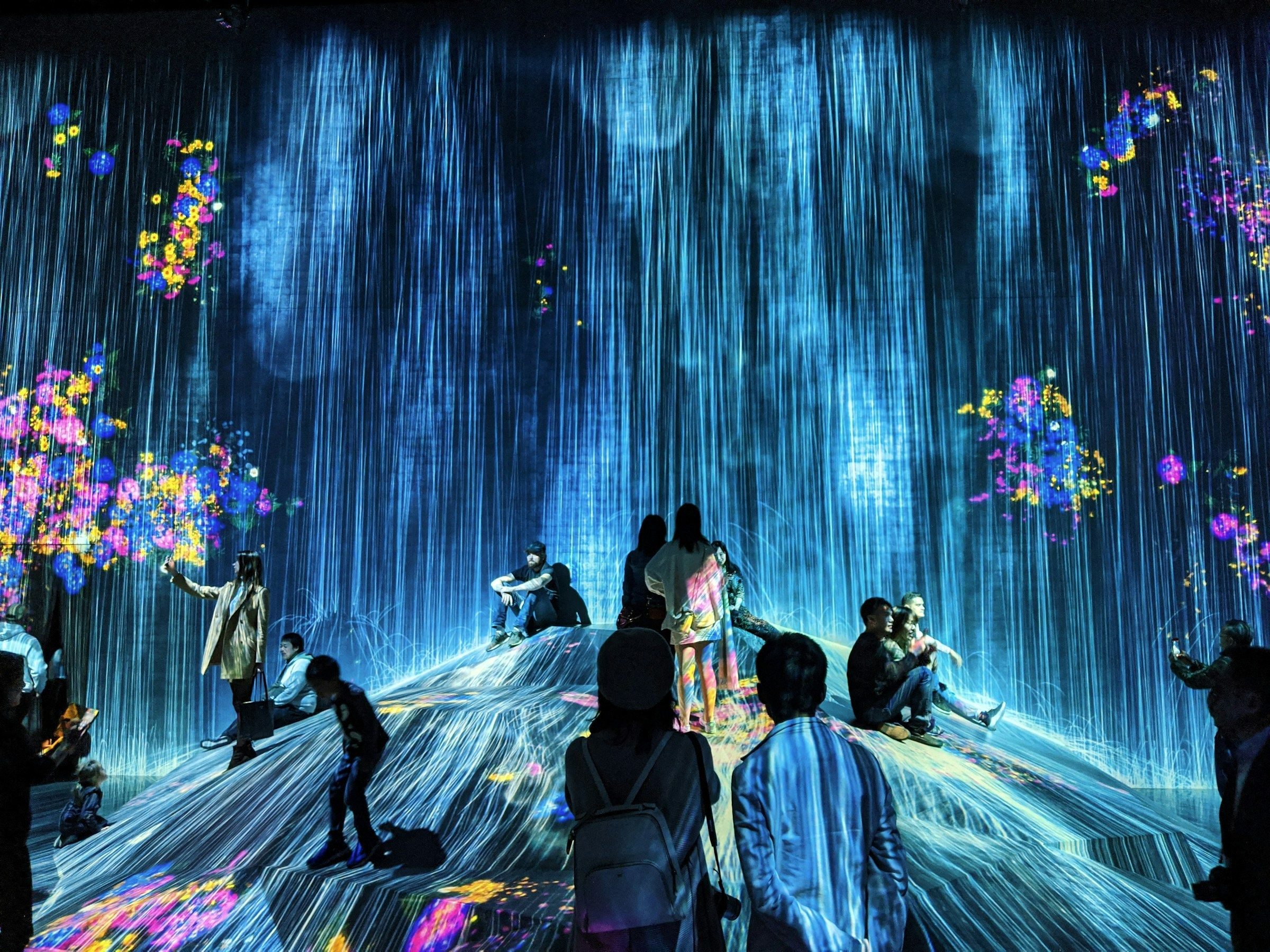 Immersive digital art installation with glowing projected light