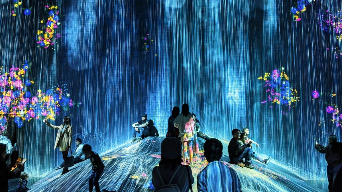 Immersive digital art installation with glowing projected light