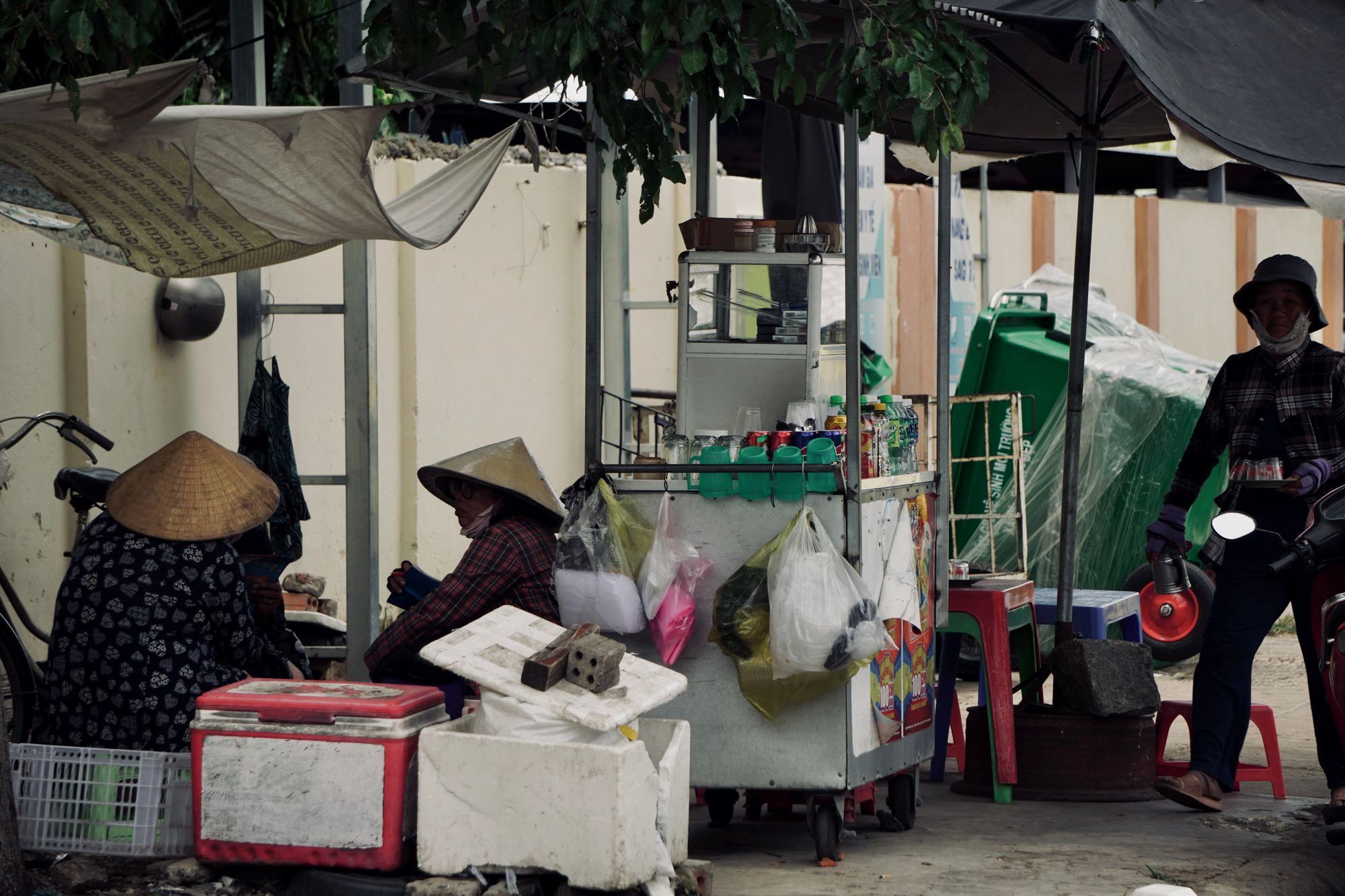A local vendor at a small market stall in an underrated city