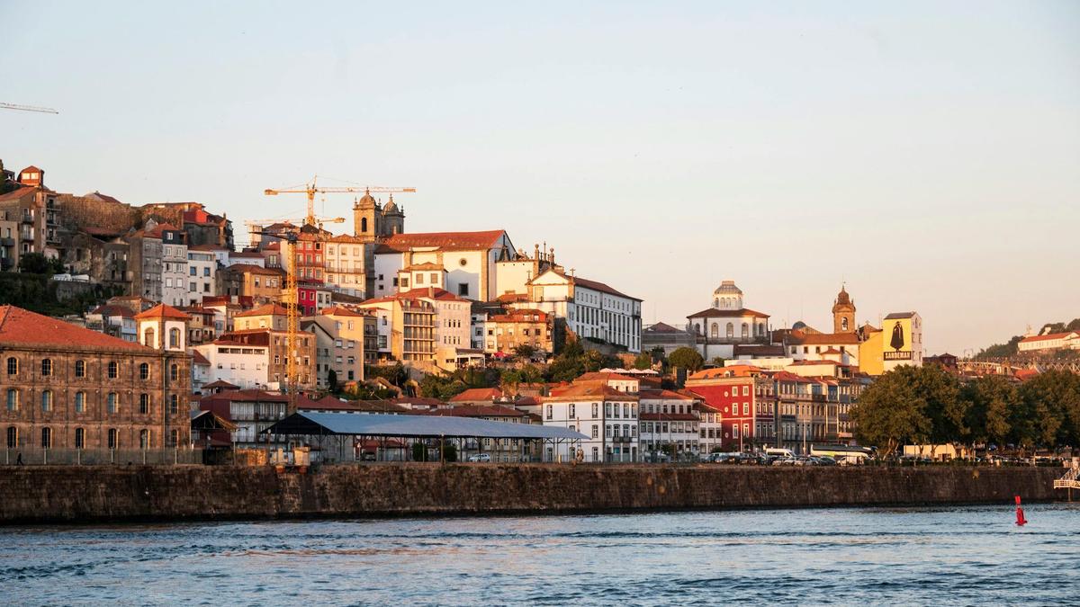 Colorful houses stacked above the Douro River in Porto, an underrated Portuguese city
